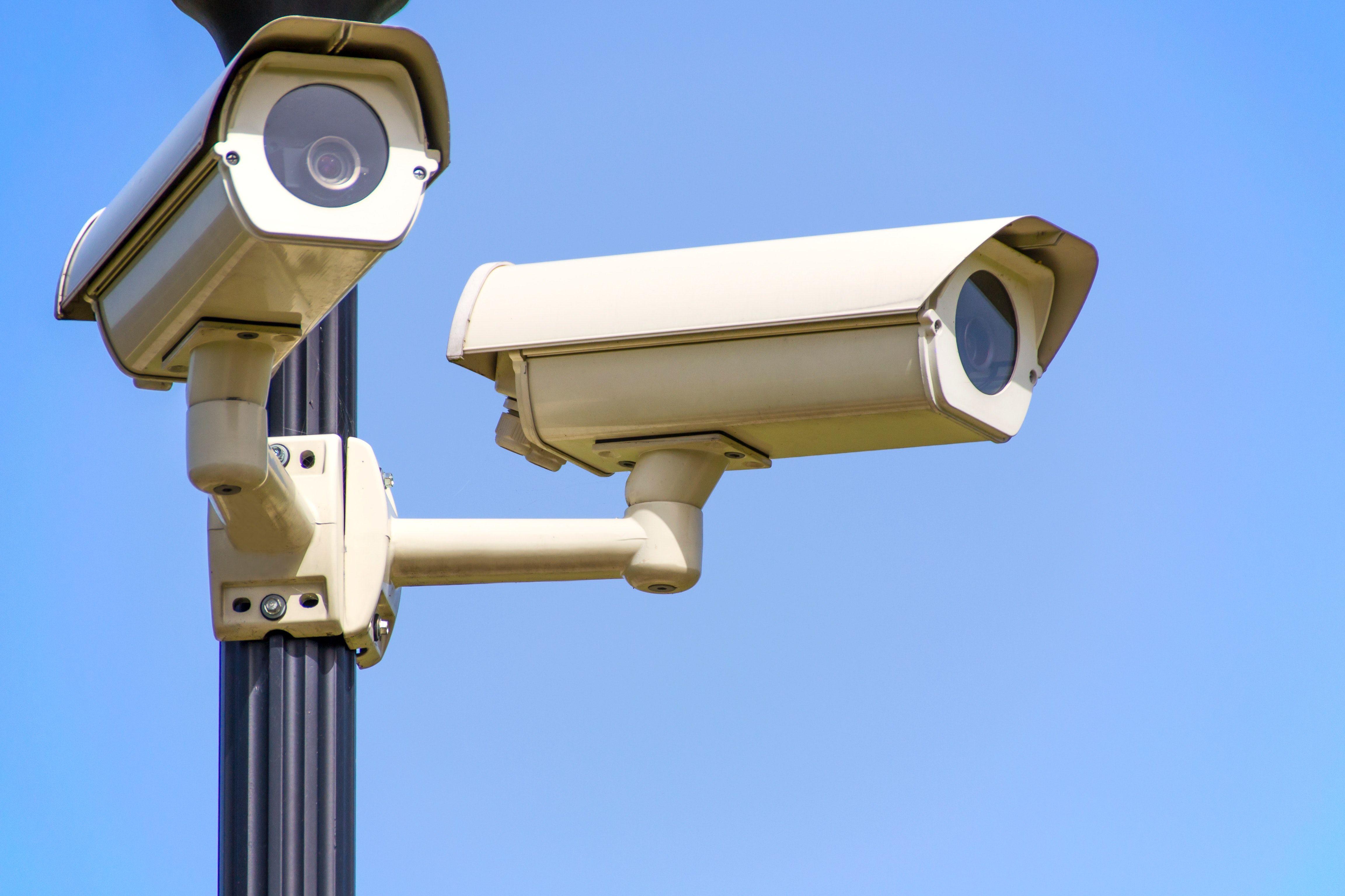 4608x3072 White 2 Cctv Camera Mounted on Black Post Under Clear Blue