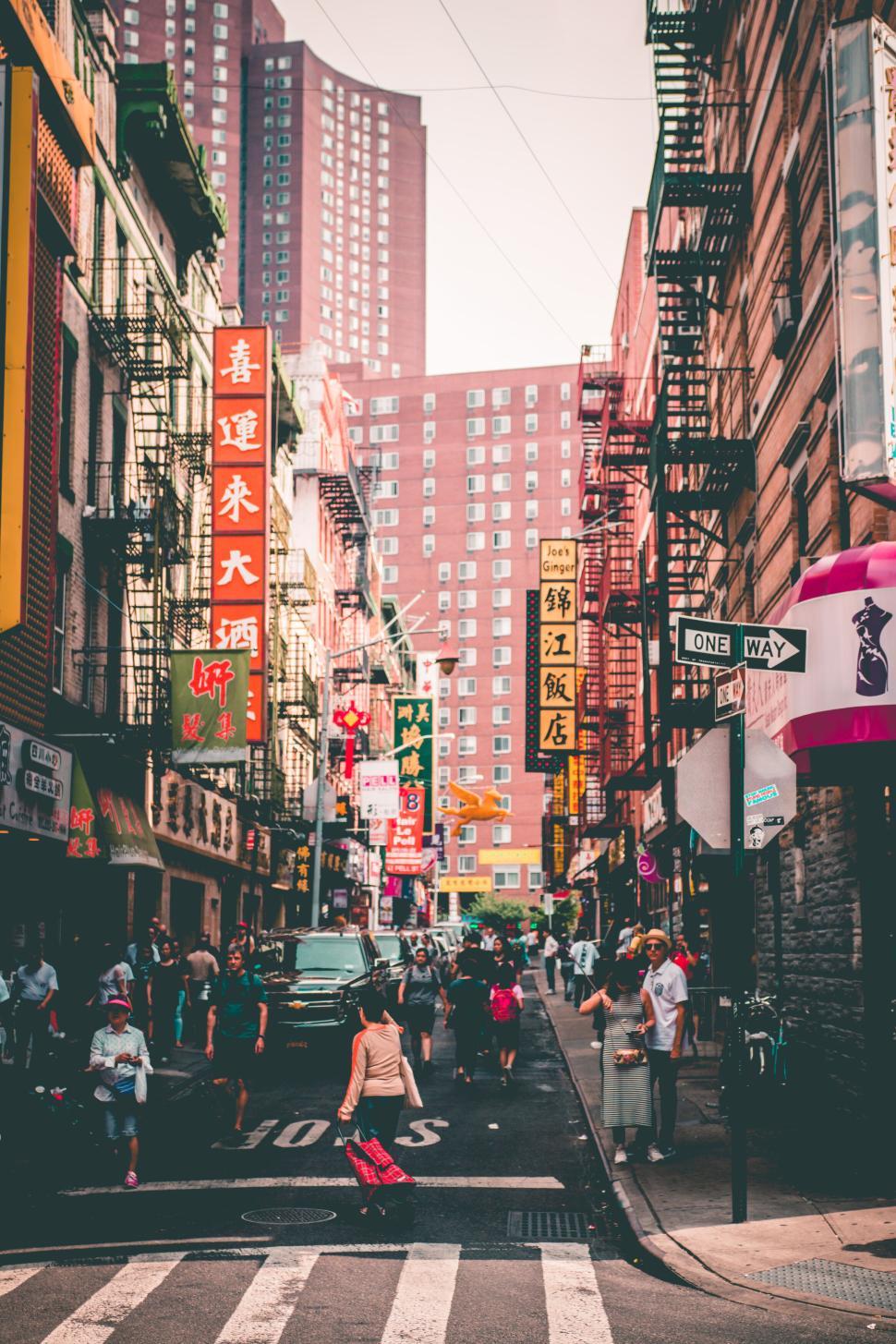 970x1455 Free of Bustling city street scene lined with various shops. Download Free Image and Free Illustrations