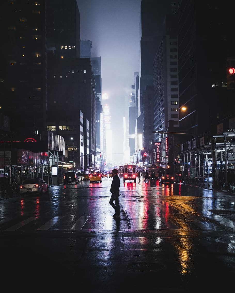 910x1137 HD Wallpaper: Man Standing Between Road, Man Walking On Pedestrian Line Near High Rise Buildings