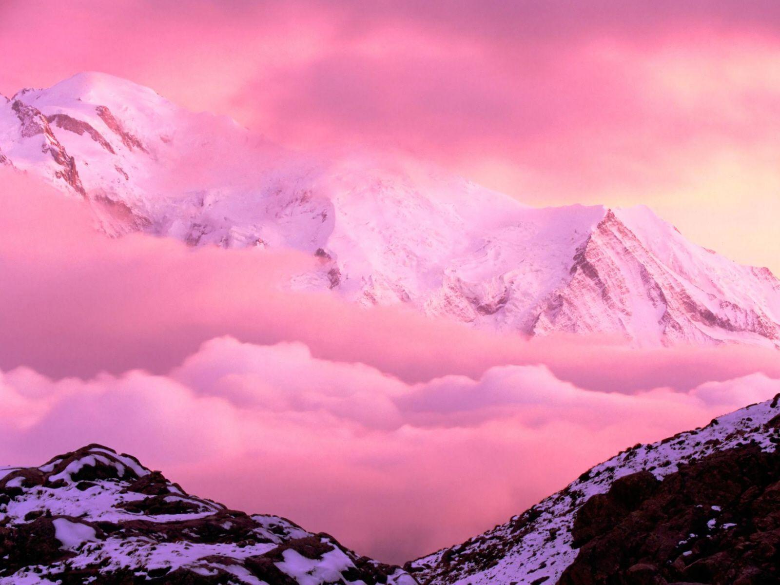 View Of The Month Above The Pink Clouds And The Mountain During Sunset