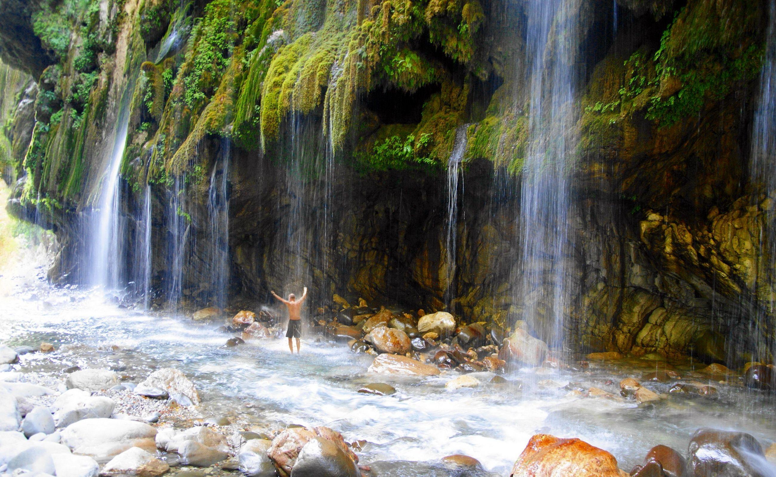 2600x1600 Download wallpaper 2600x1600 greece, falls, rocks, guy, back