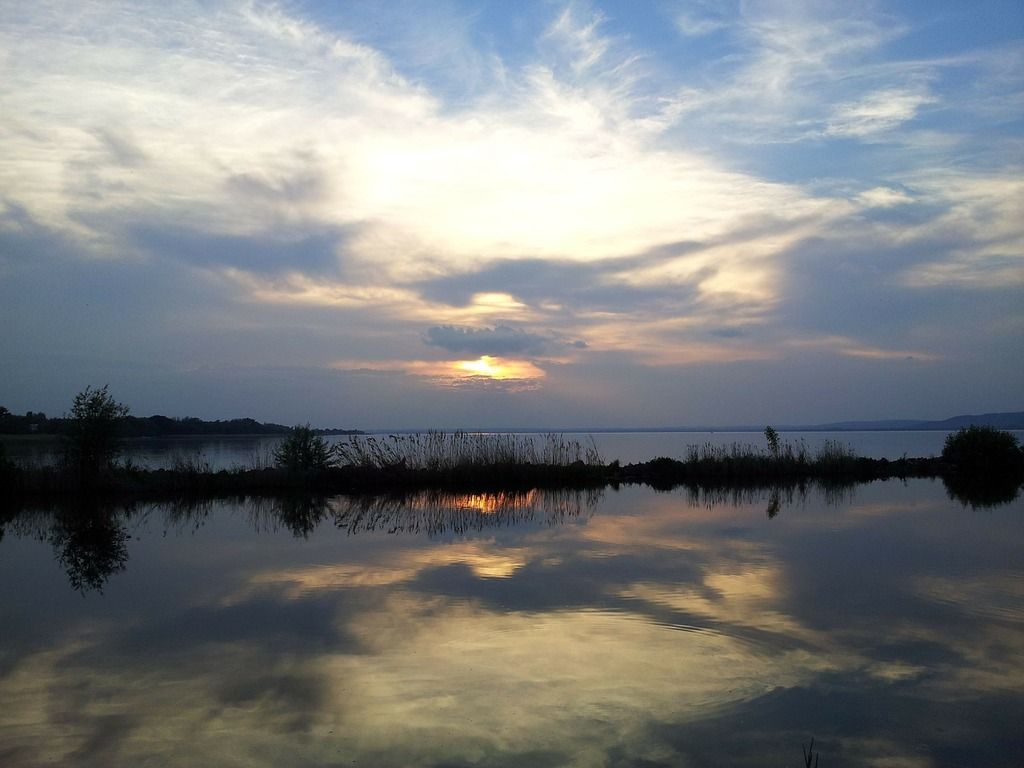 1024x768 The sun is setting over a body of water. Lake balaton balaton lake. Domain Media Search Engine Public Domain Image