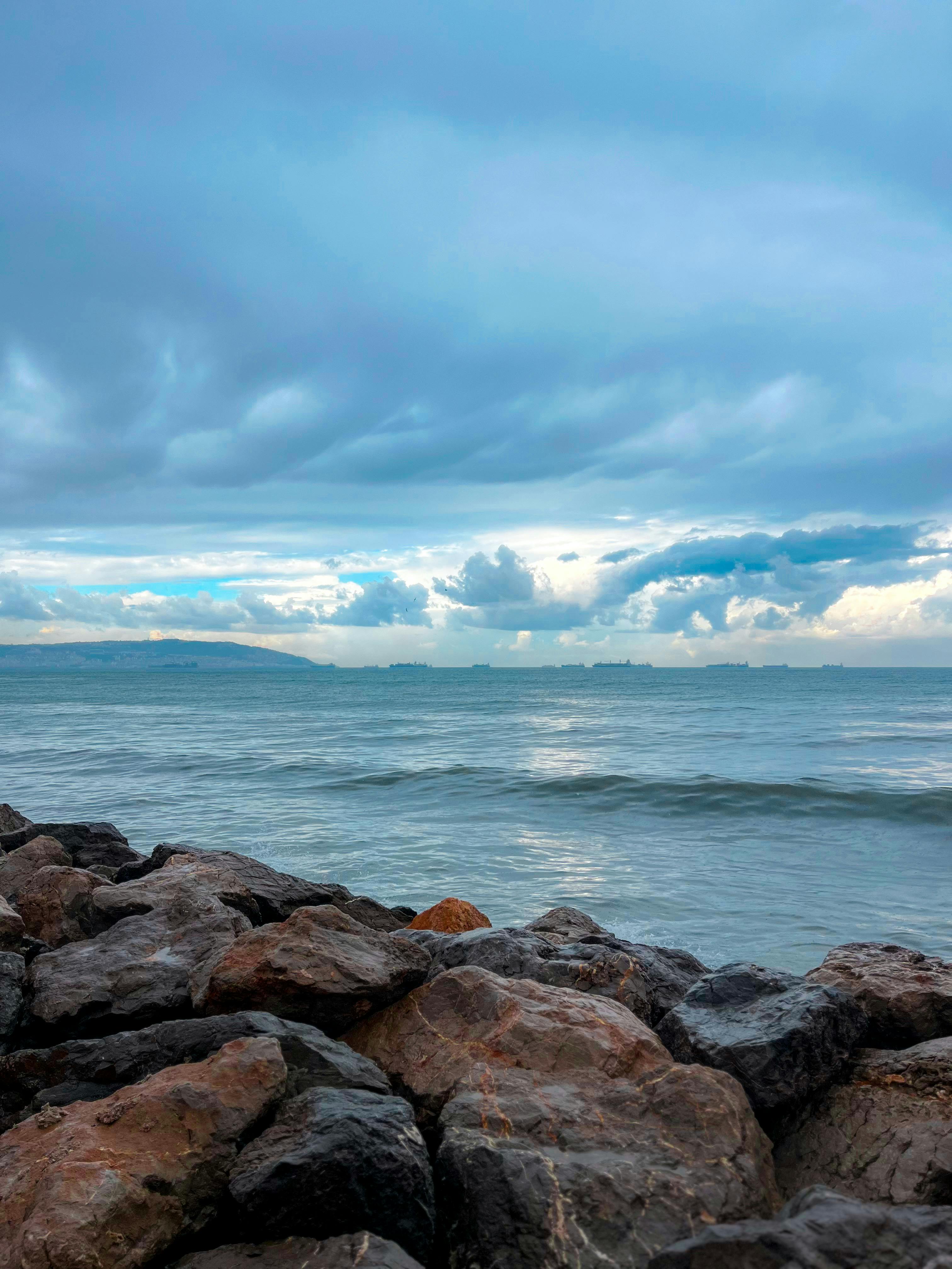 3024x4032 Scenic Ocean View with Dramatic Clouds and Rocks · Free