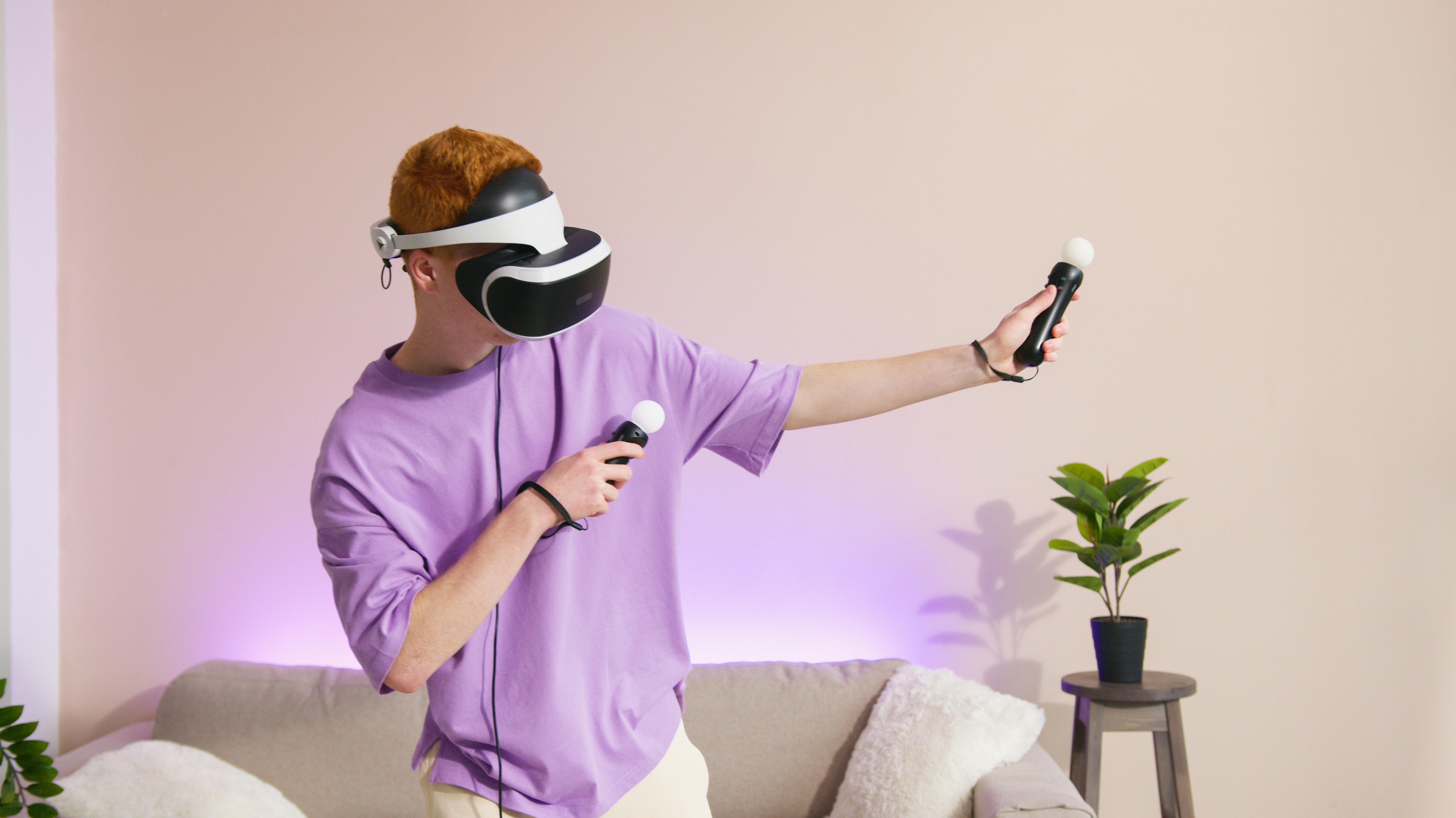 6144x3456 A Person Paying a Video Game while Wearing a VR Headset · Free