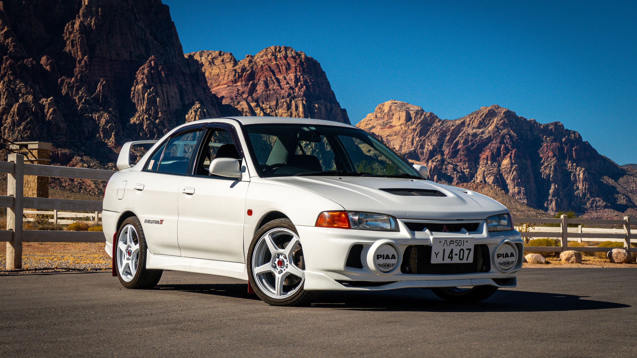 2560x1440 The Mitsubishi Lancer Evolution IV Is a Rowdy Rally Legend Without the JDM Markup