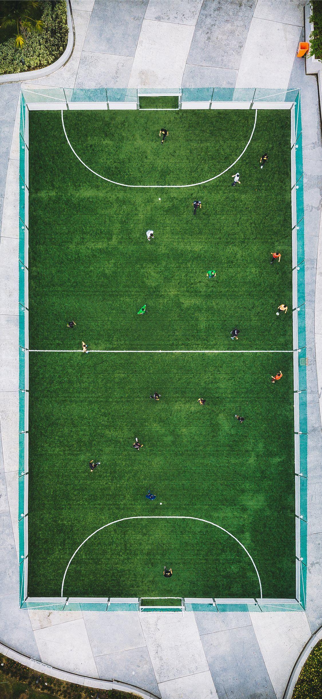 1125x2436 aerial photography of people playing soccer iPhone X Wallpaper