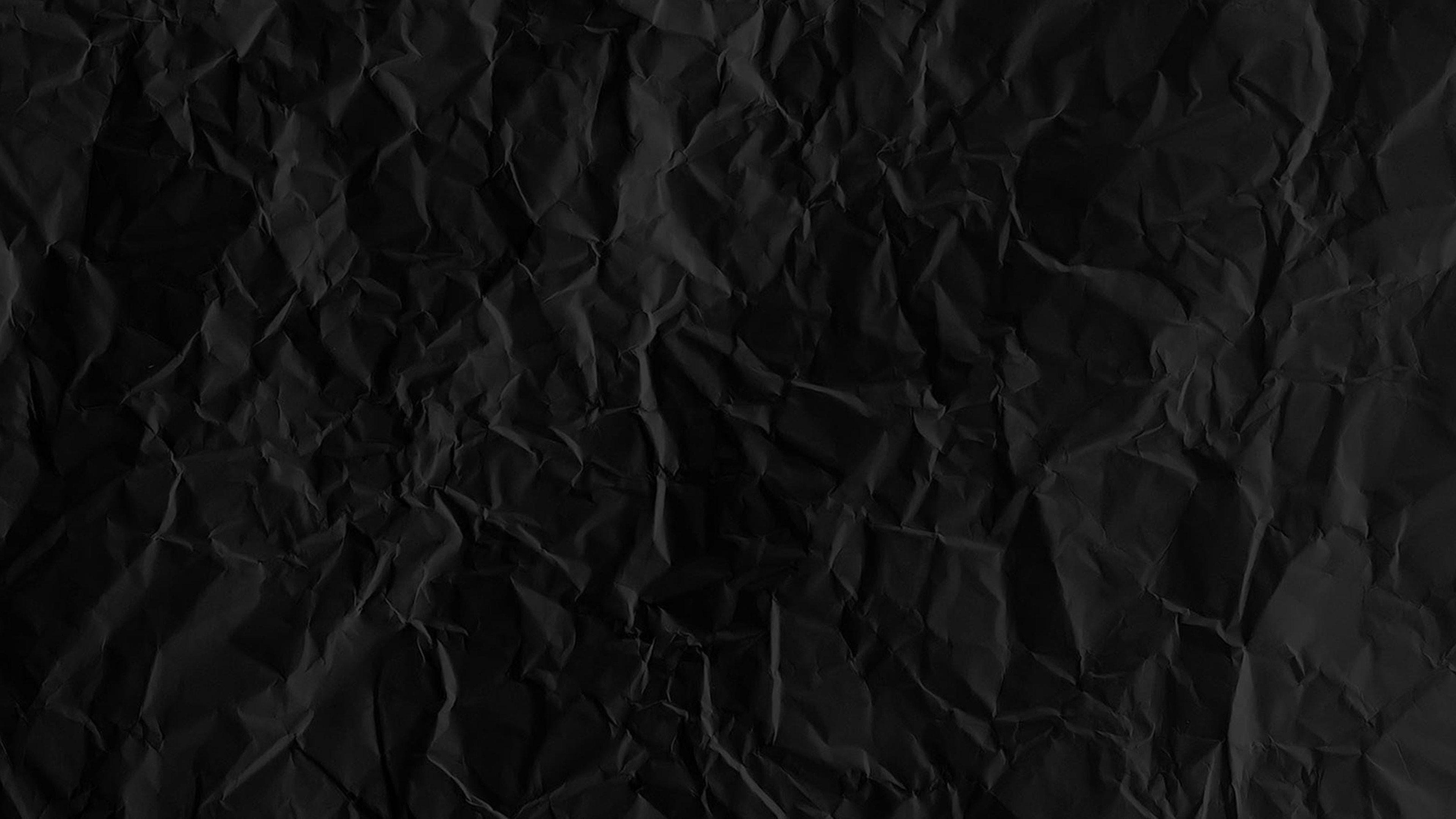 Black page. Темный фон. Черная мятая бумага. Черные обои. Черная текстура.