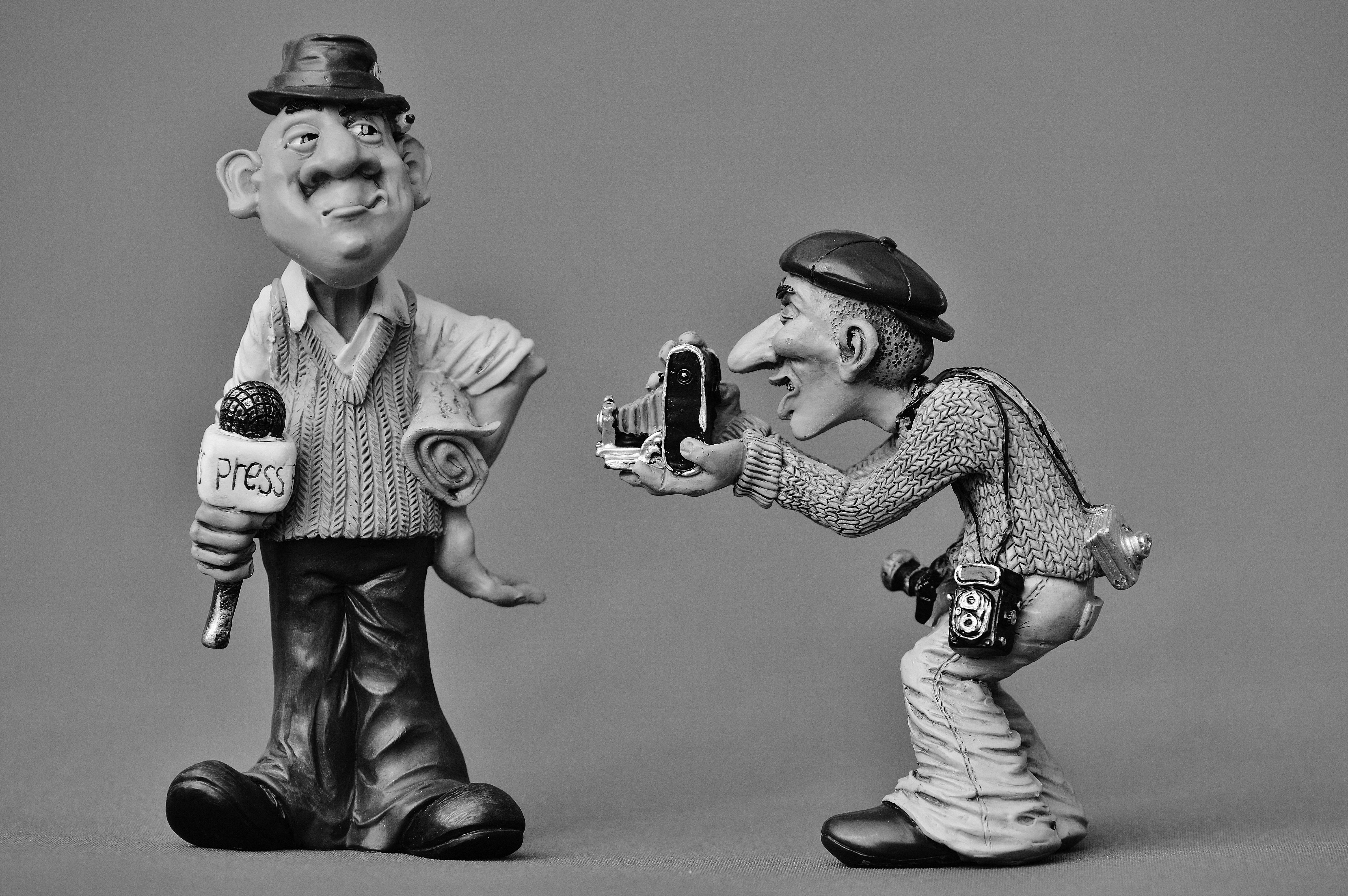 6016x4000 gray scale photography of two man reporter free image