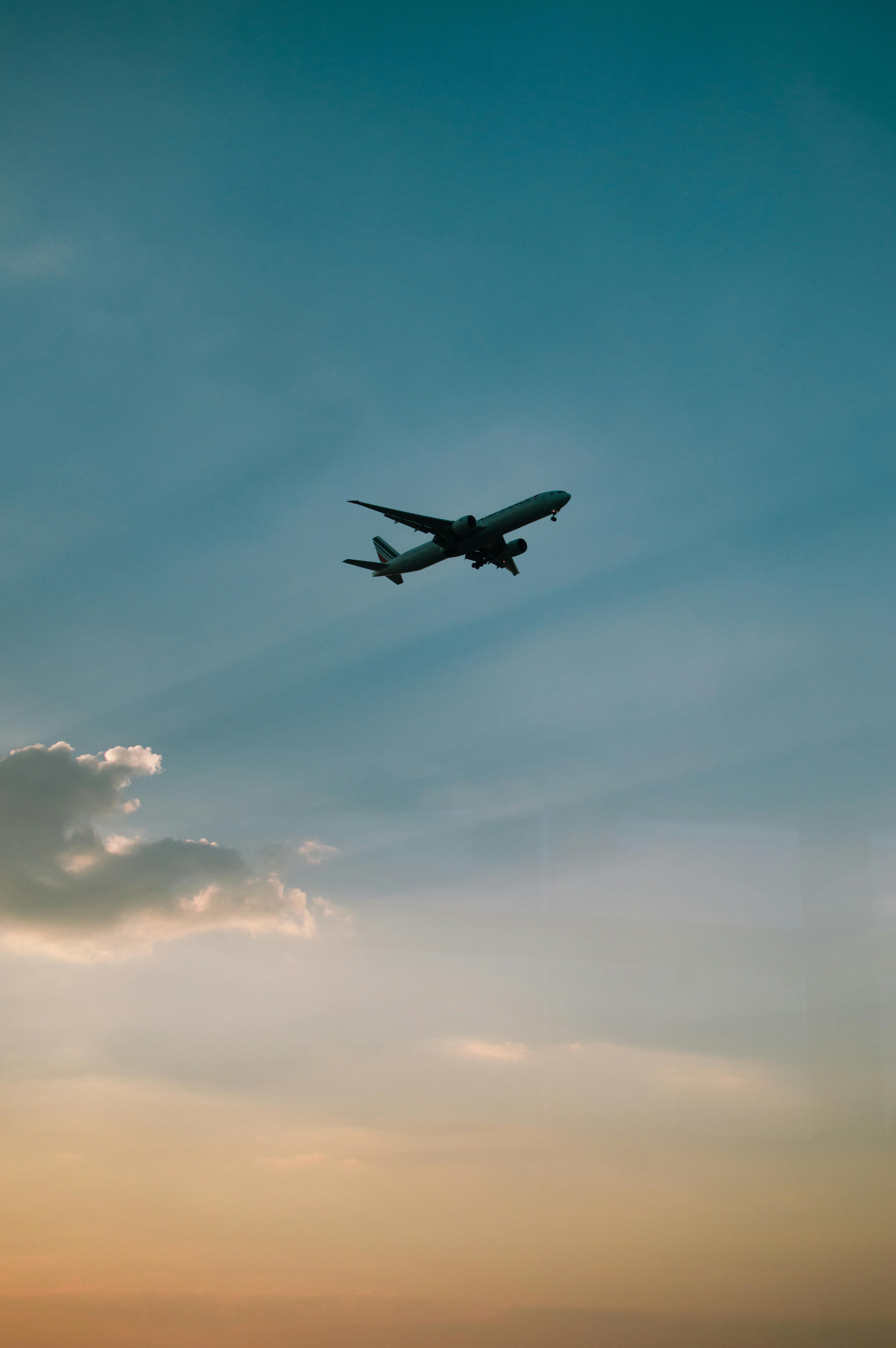 4000x6016 Airplane Flying in Sunset Sky · Free