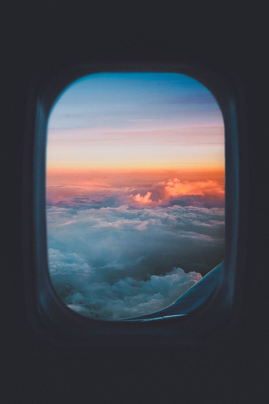 910x1365 HD wallpaper: plane window overlooking sea of clouds, porthole, sunset, airplane