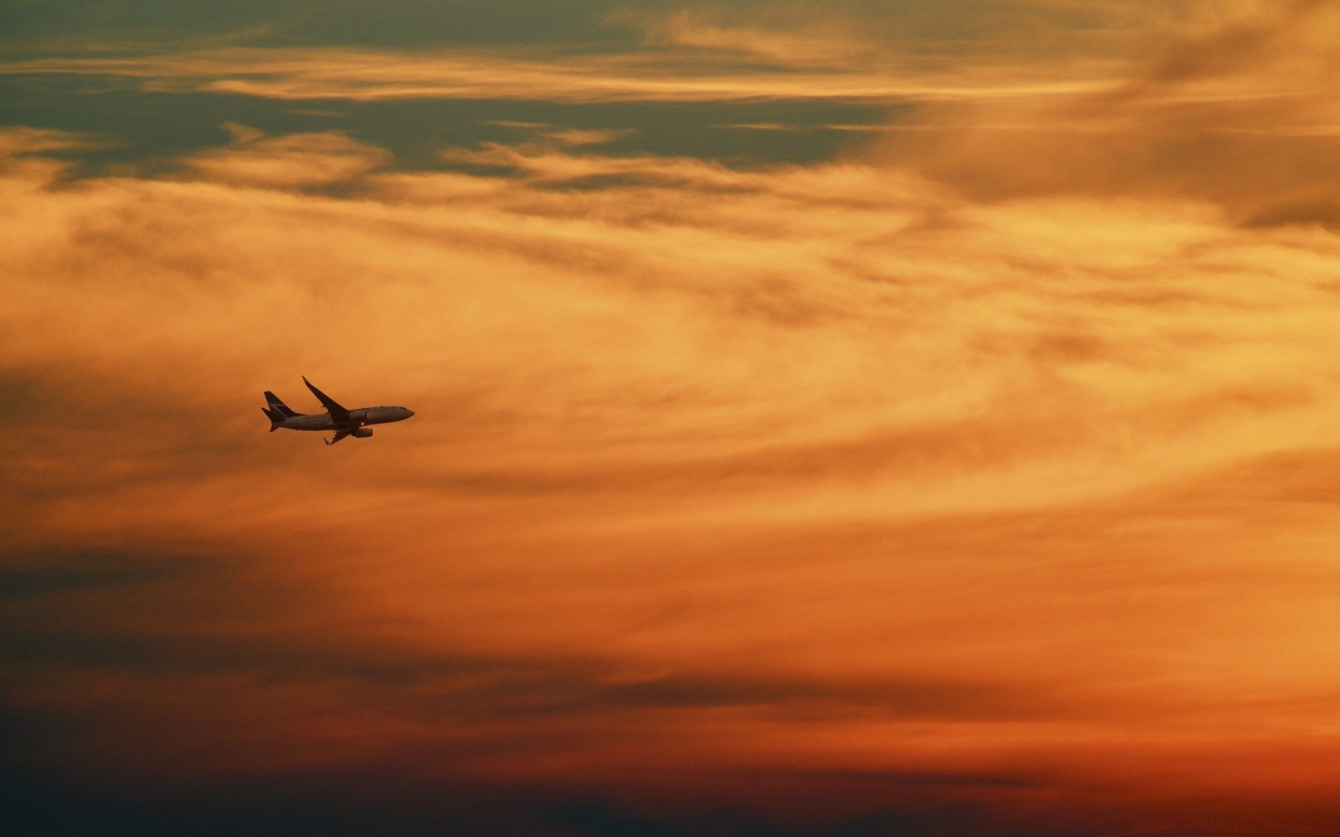 1920x1200 Flying plane at sunset