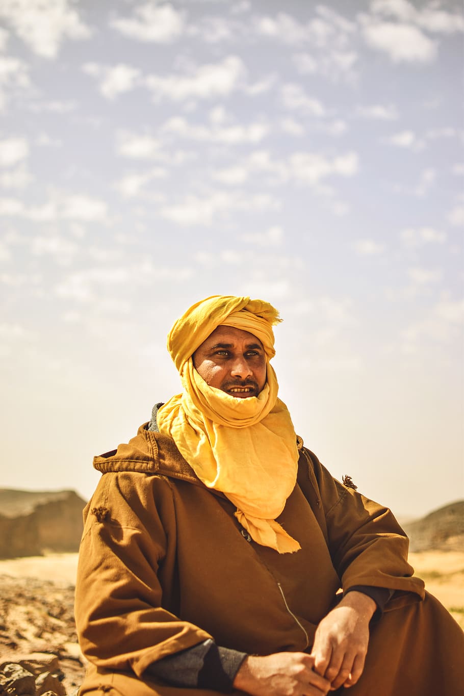 910x1365 HD wallpaper: Photo of a Man Sitting, adult, bedouin, blur, daylight, daytime