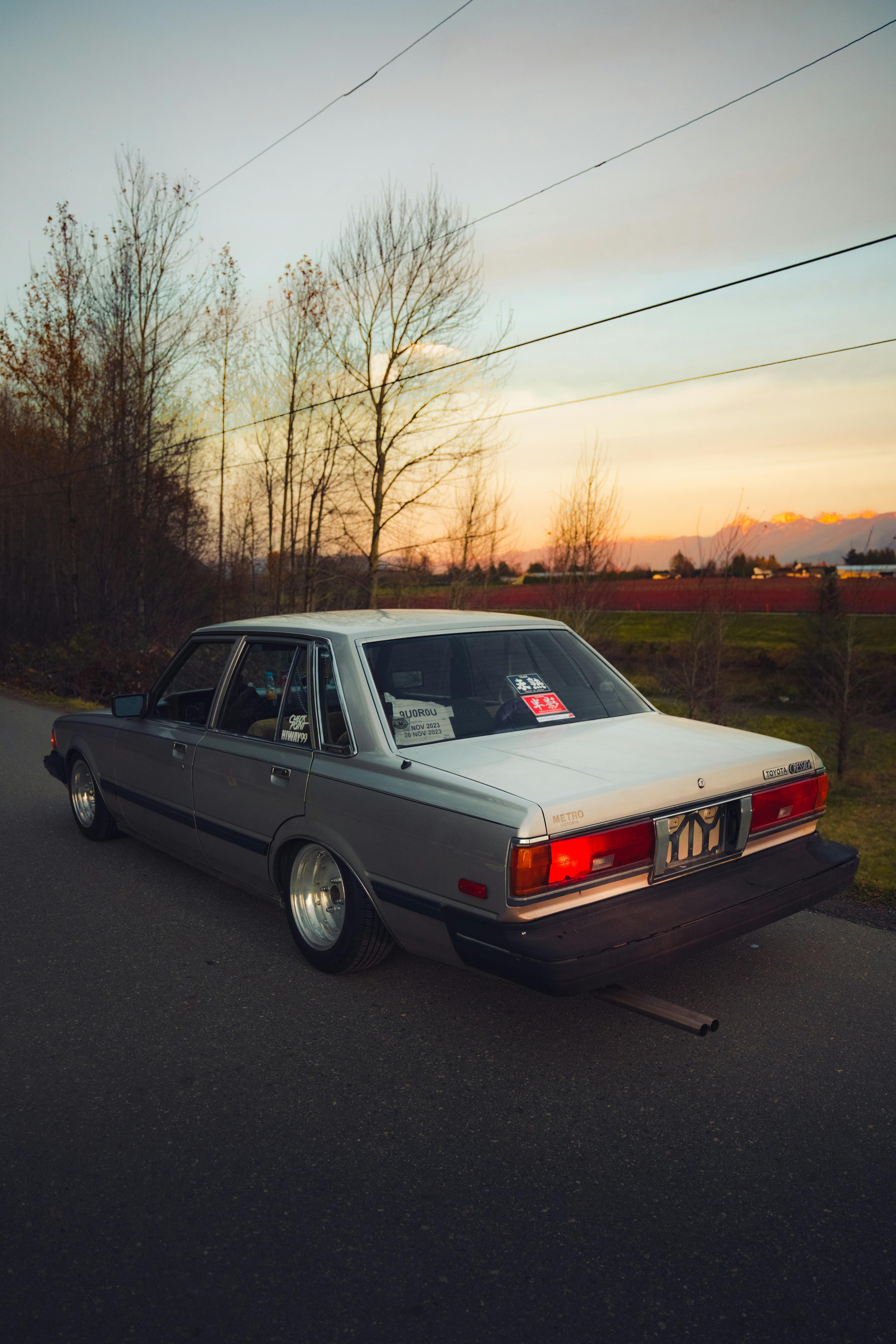 4303x6454 Lowered Modified Silver Toyota Cressida Parked on Country Road · Free
