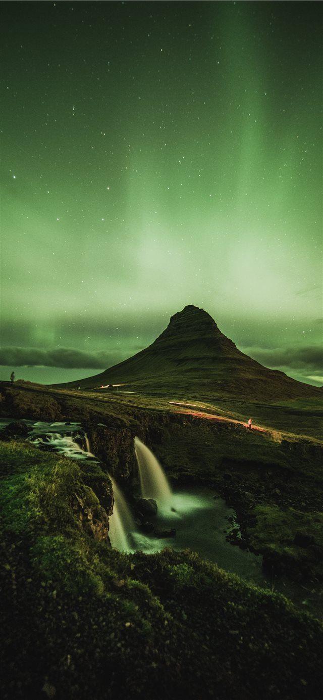 640x1385 waterfalls near mountain taken under green sky iPhone 11