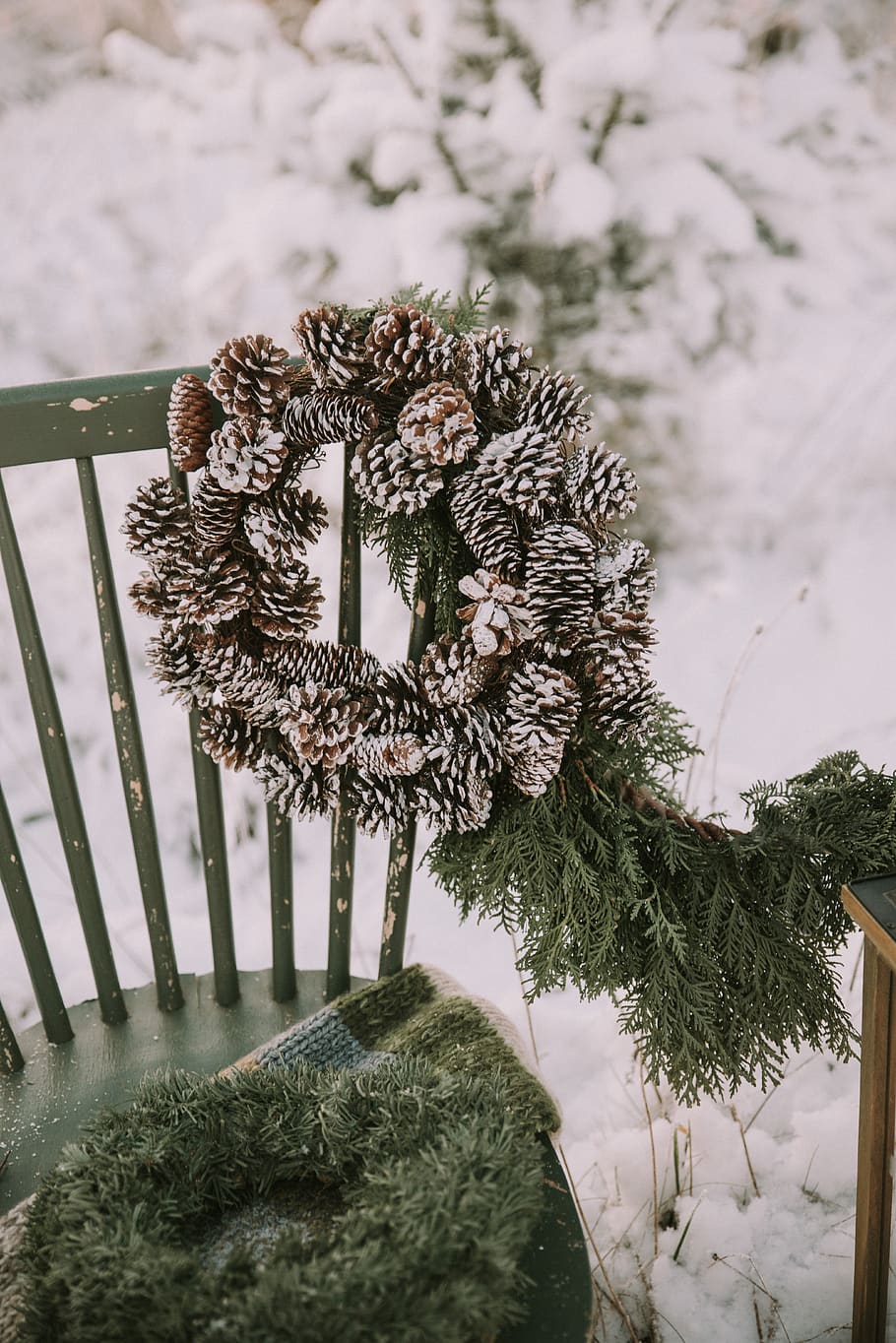 910x1364 HD wallpaper: brown pine cone wreath hanged on chair, outdoors