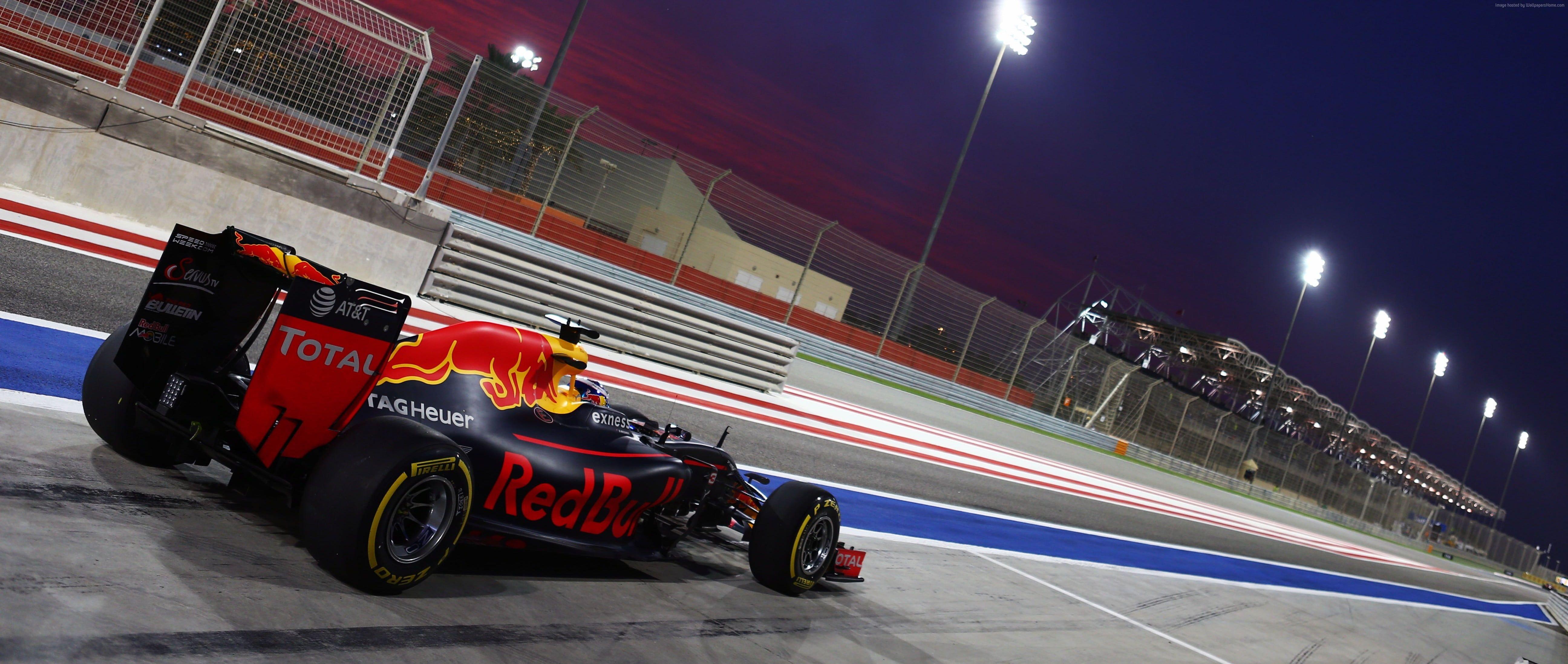 5184x2195 Photo of black and red Total RedBull racing kart on racing arena
