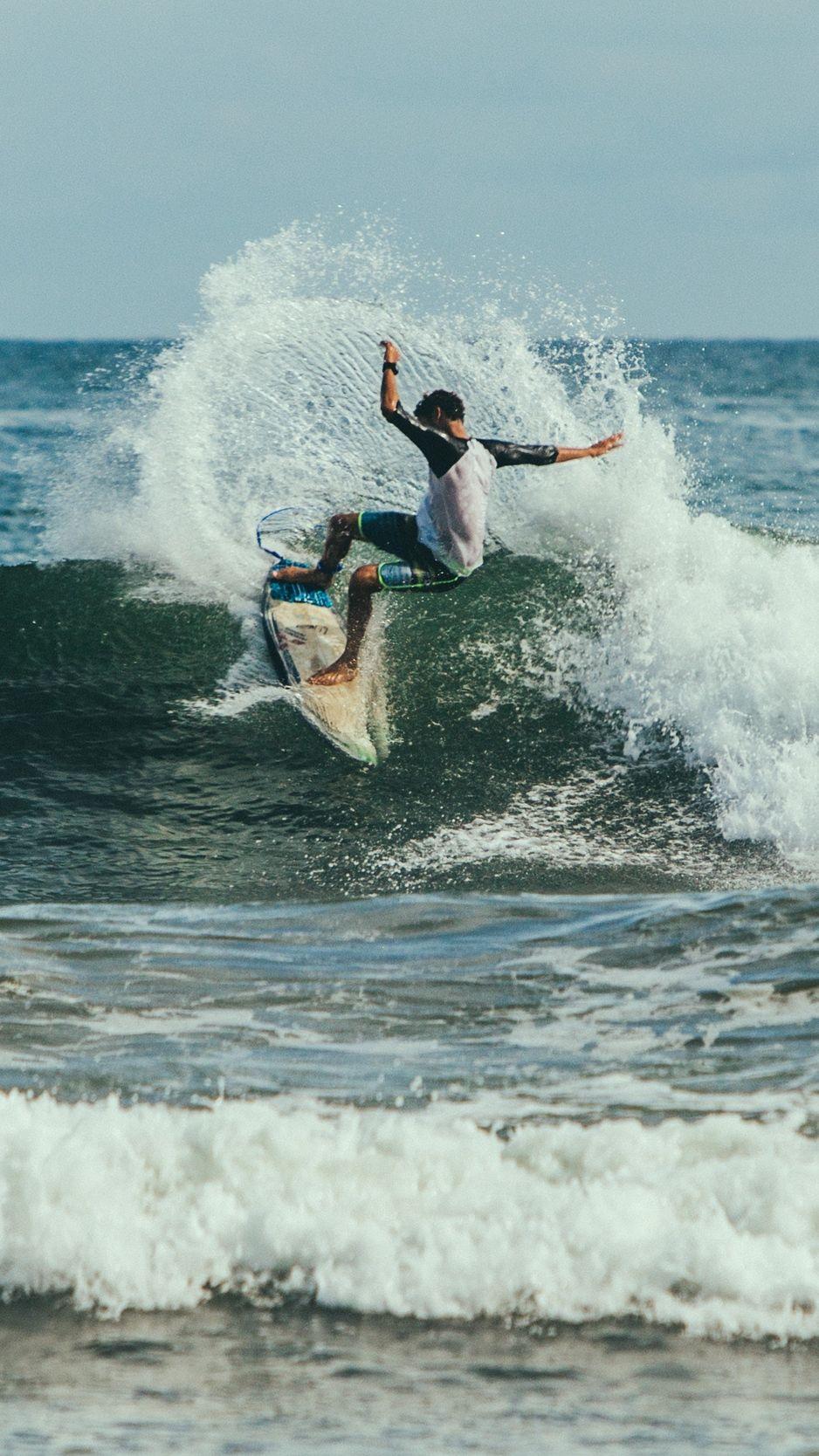 938x1668 Download wallpaper 938x1668 surfing, surfer, trick, wave iphone 8