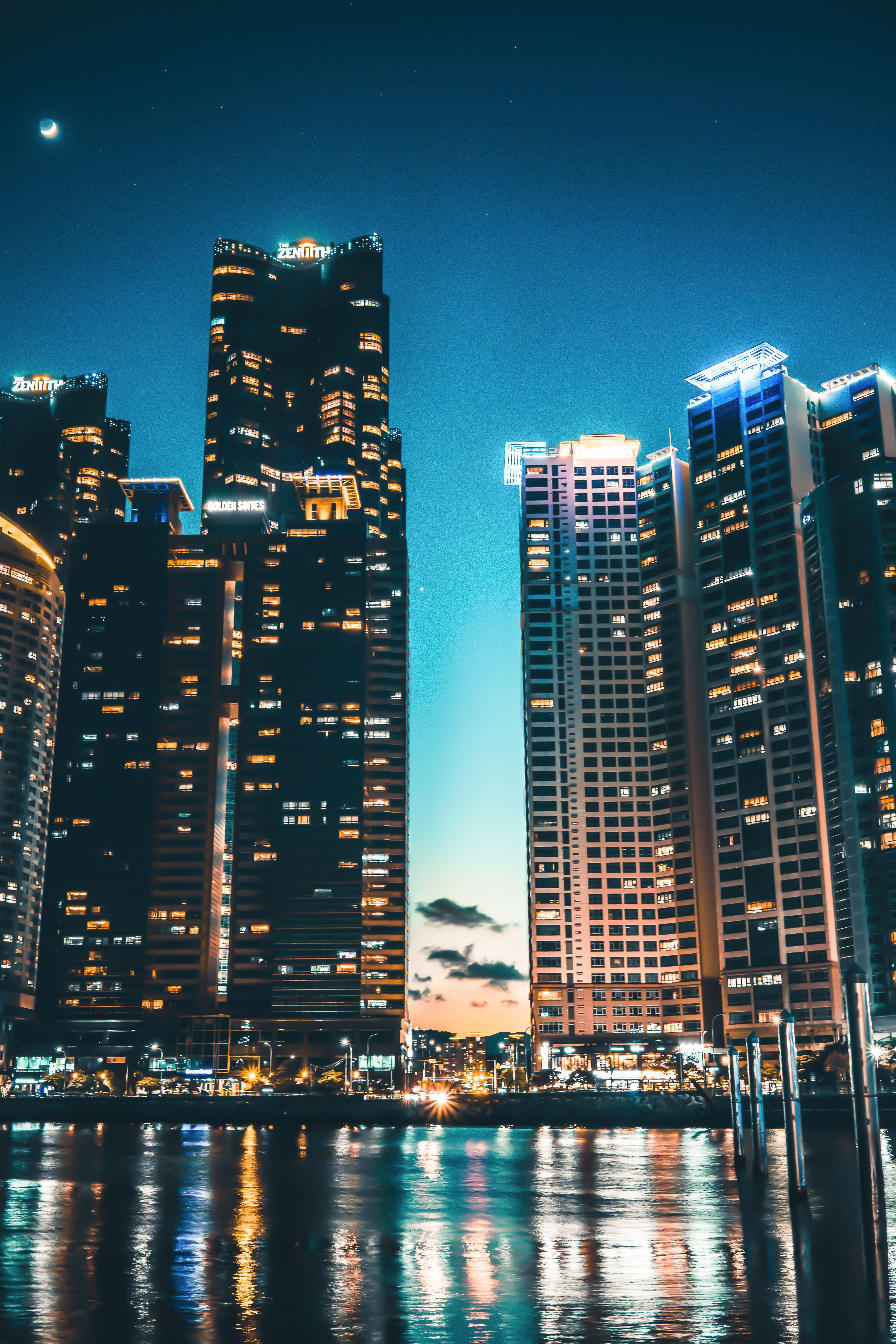 5081x7617 Download wallpaper 5081x7617 skyscrapers, shore, night city, busan