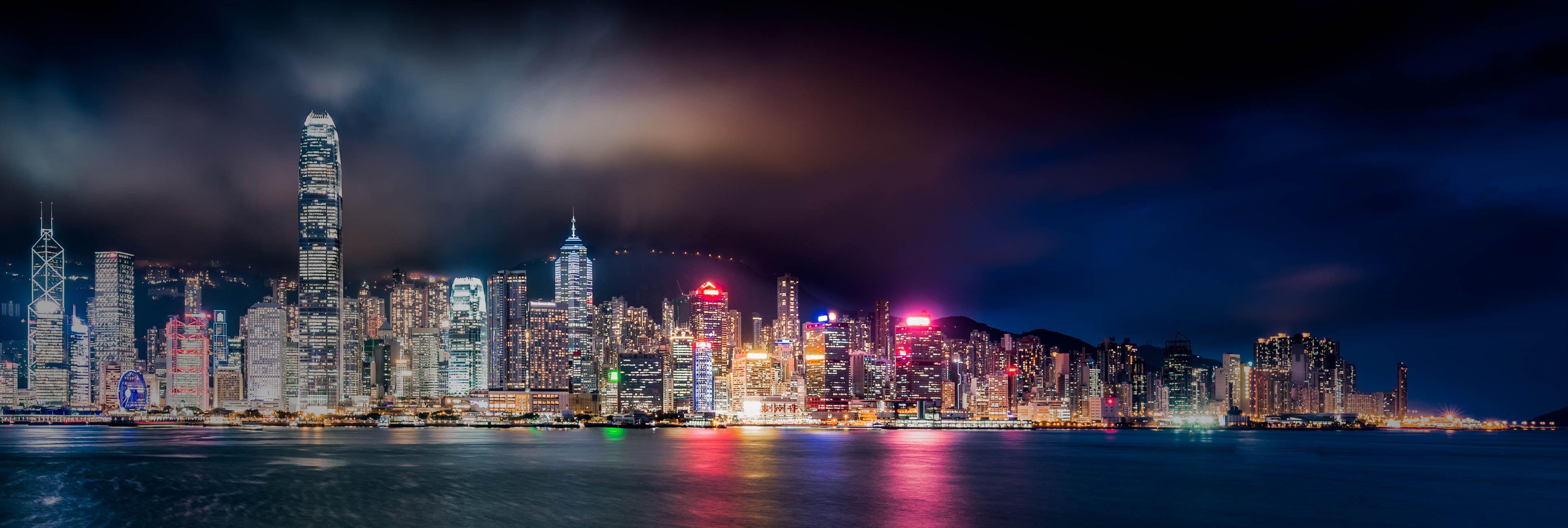3852x1297 Panoramic photography of city lights near body of water during