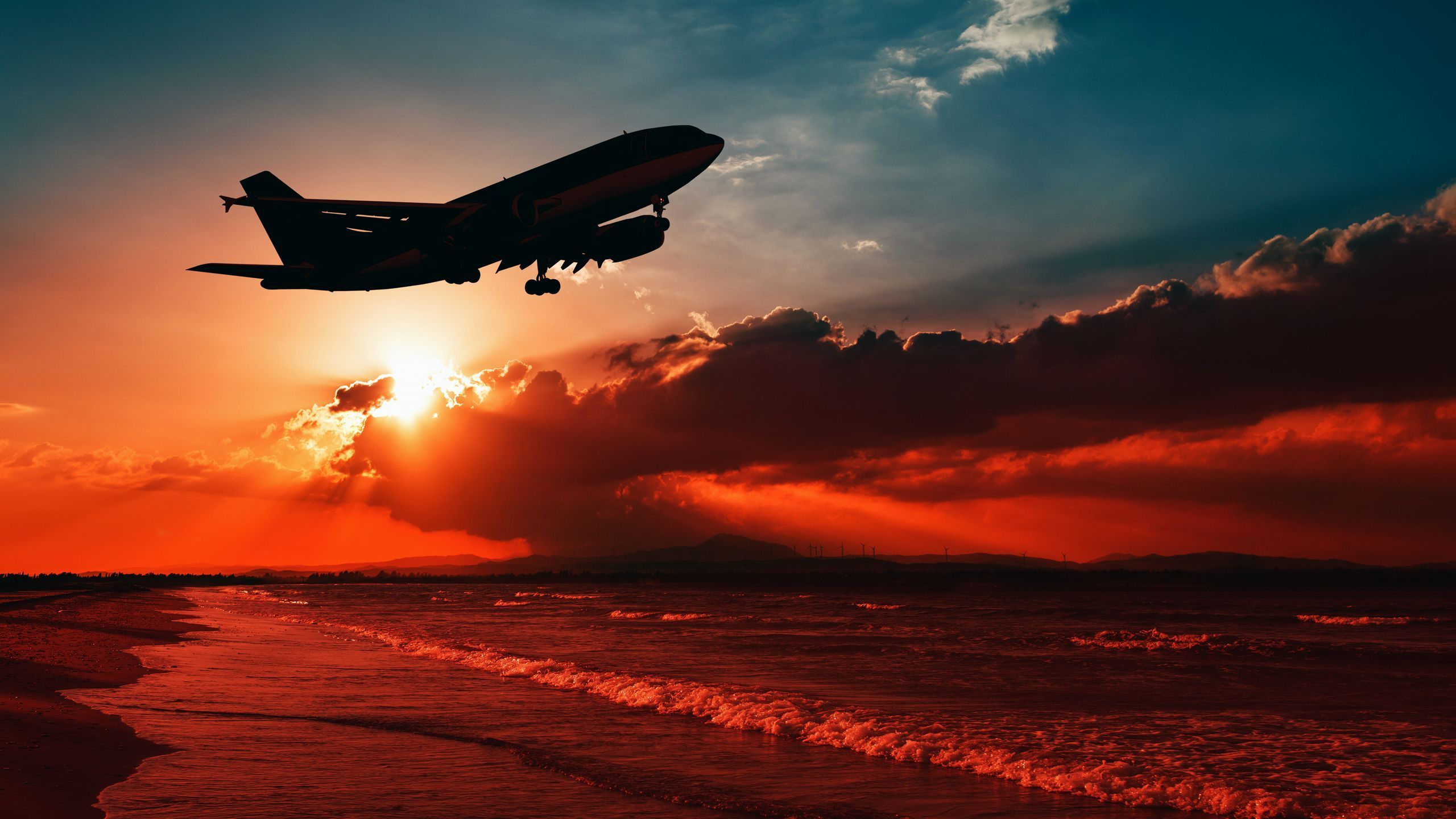 2560x1440 Download wallpaper 2560x1440 airplane, sea, sunset, takeoff, silhouette, sky widescreen 16:9 HD background