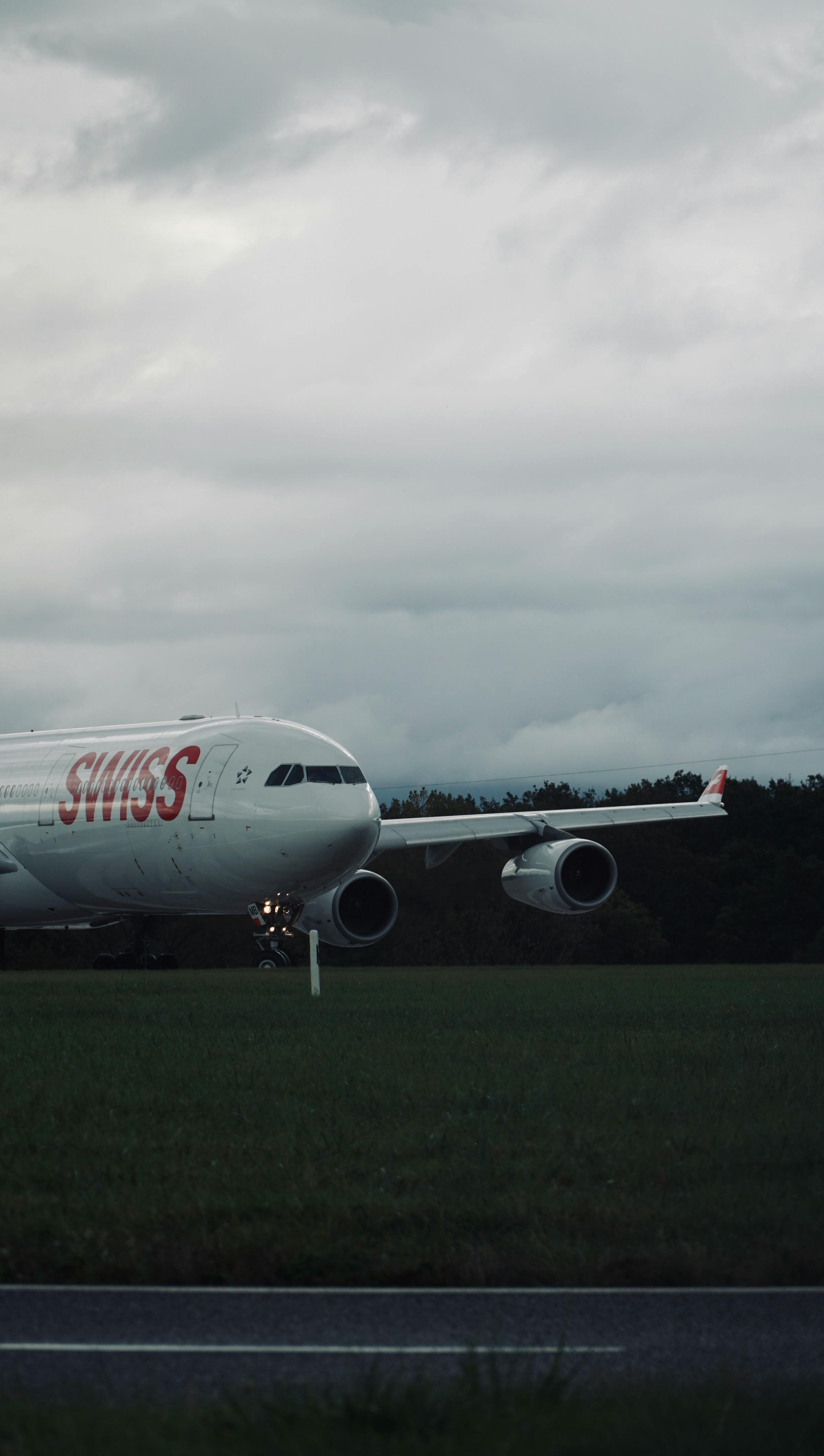 2400x4240 Swiss Airlines Airplane on Runway Before Takeoff · Free