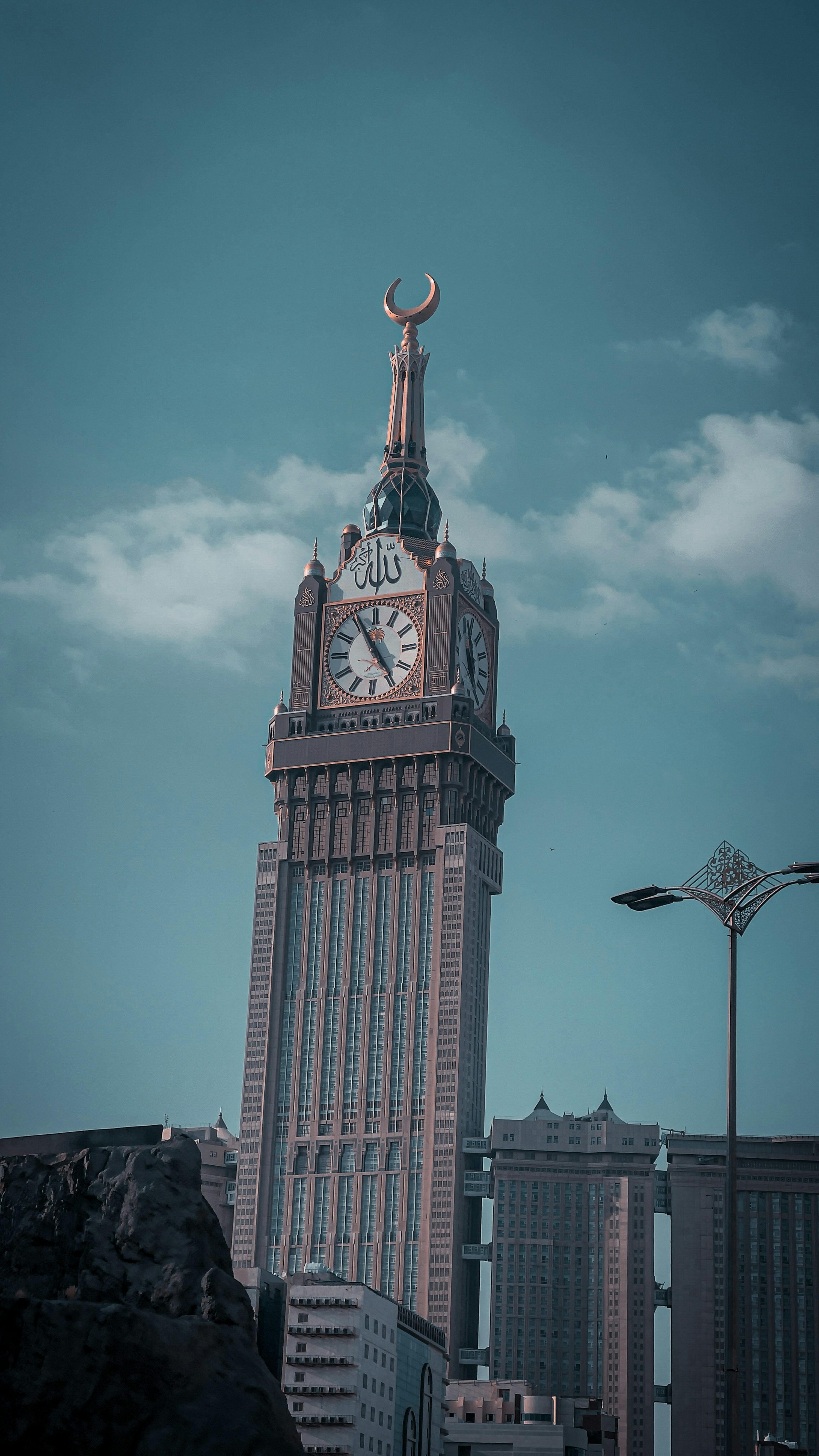 3000x5333 A tall clock tower with a sky background photo