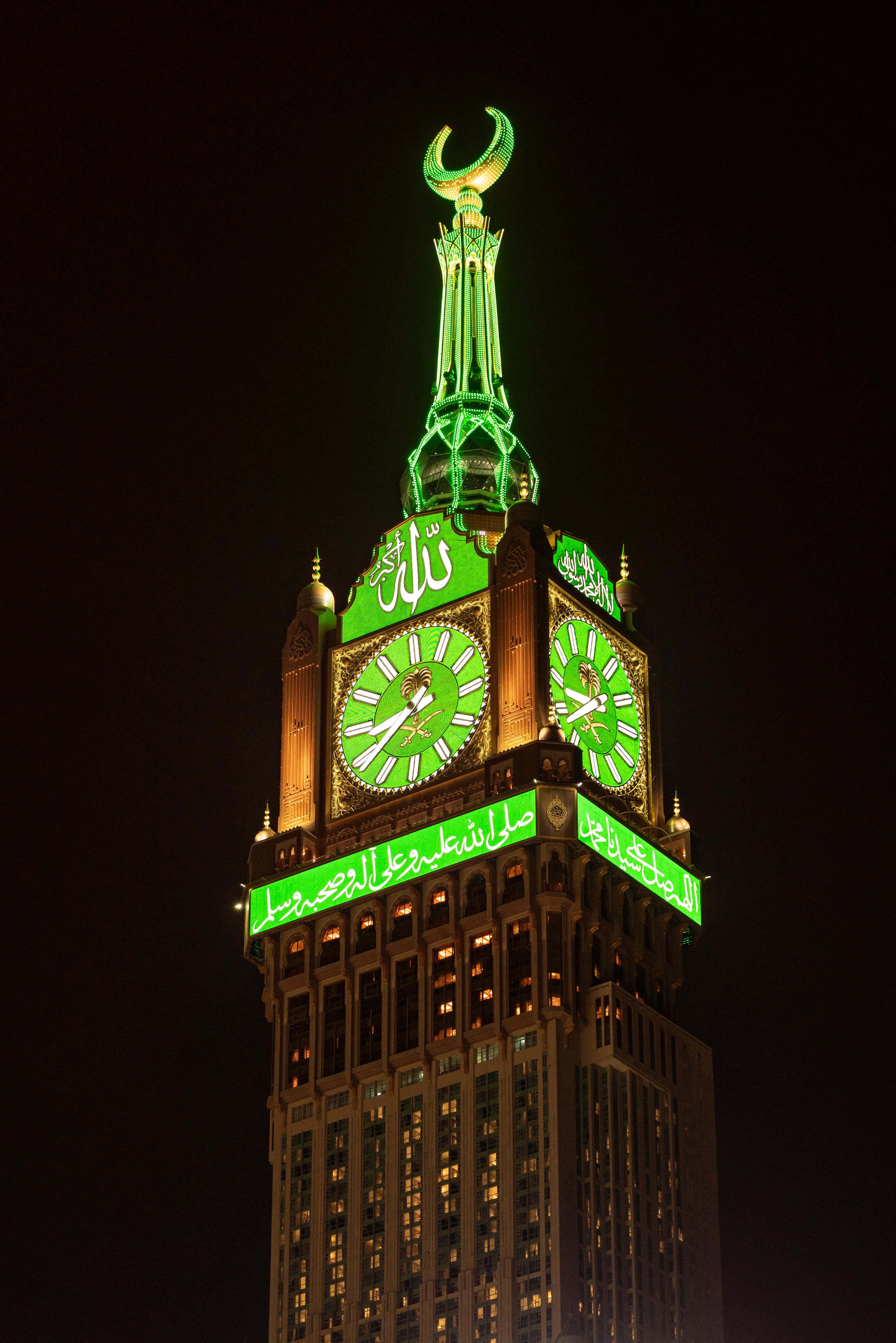 3448x5168 Photo of an Illuminating Makkah Royal Clock Tower at Night, Mecca, Saudi Arabia · Free