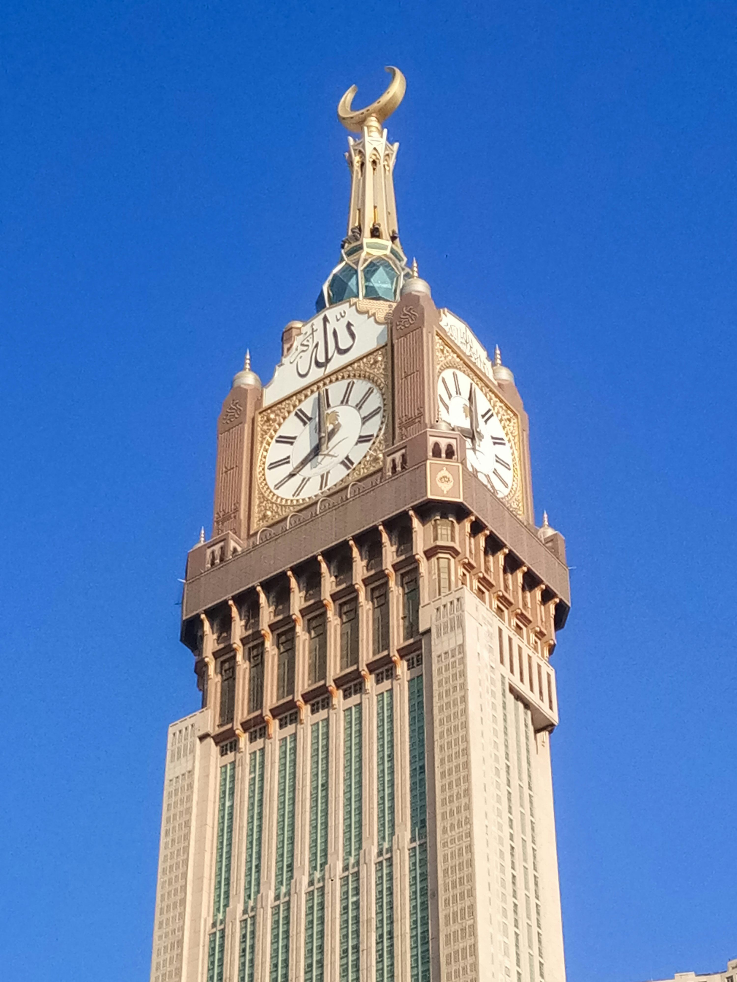 3000x4000 A tall clock tower with a sky background photo