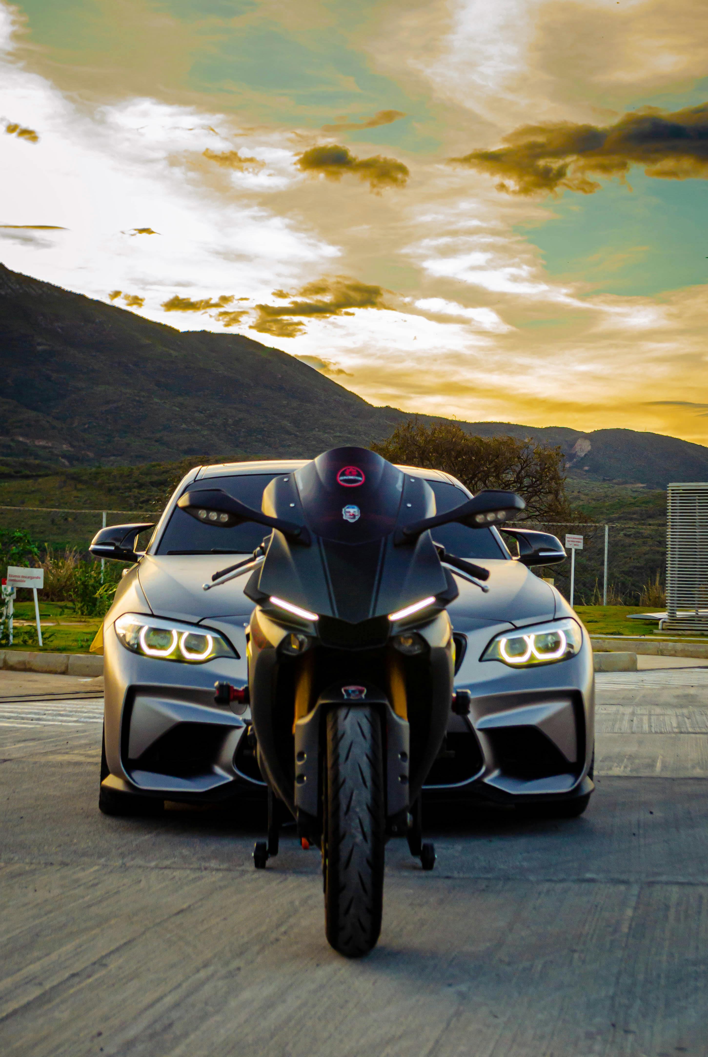 2902x4334 A Car and a Motorcycle · Free