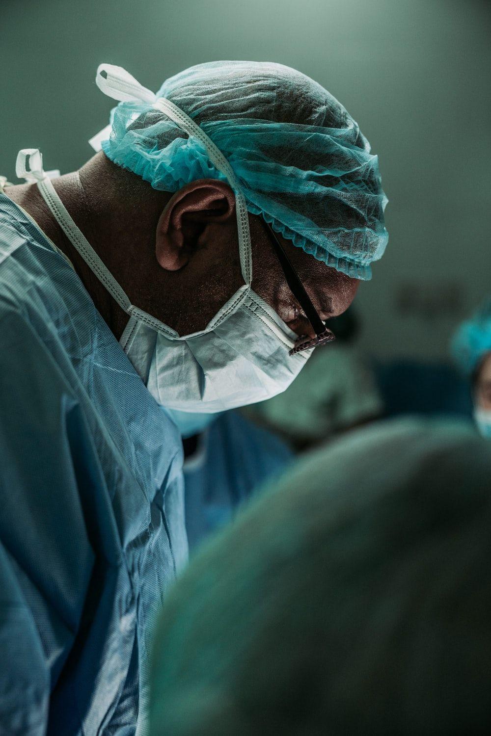1000x1500 man wearing medical mask and robe photo