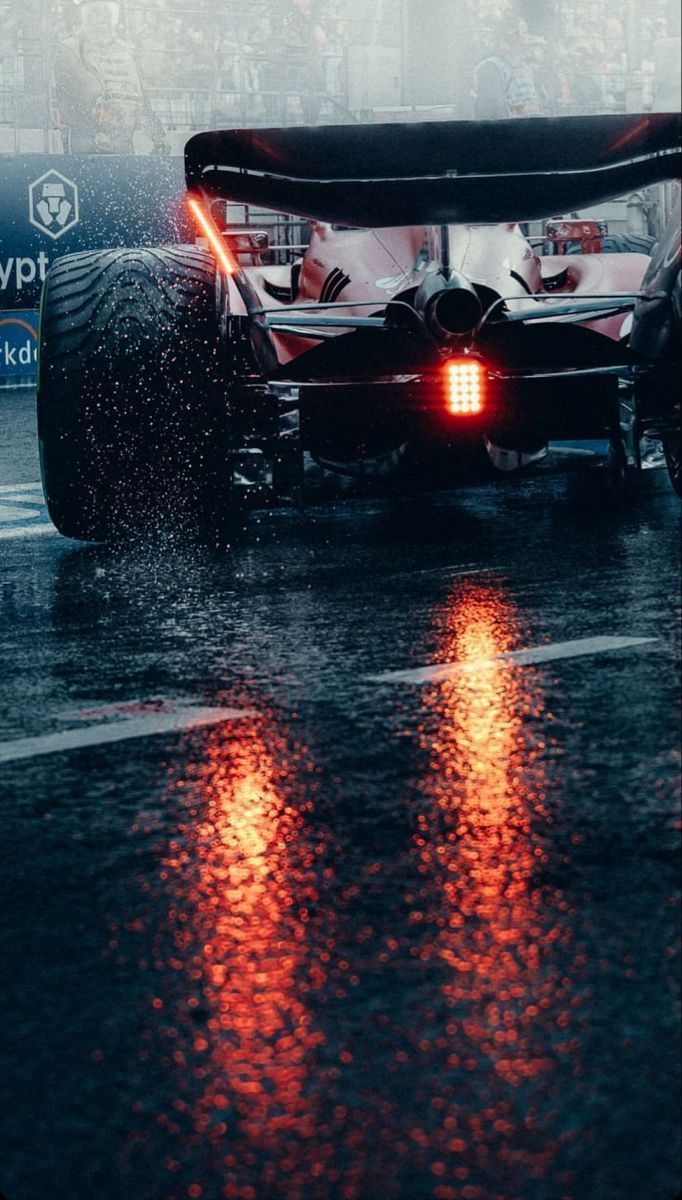 682x1200 Formula 1 Car Racing in the Rain