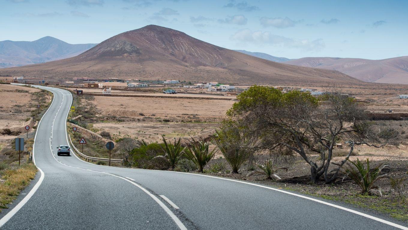 1360x768 fuerteventura, highway, road Desktop Laptop HD Wallpaper