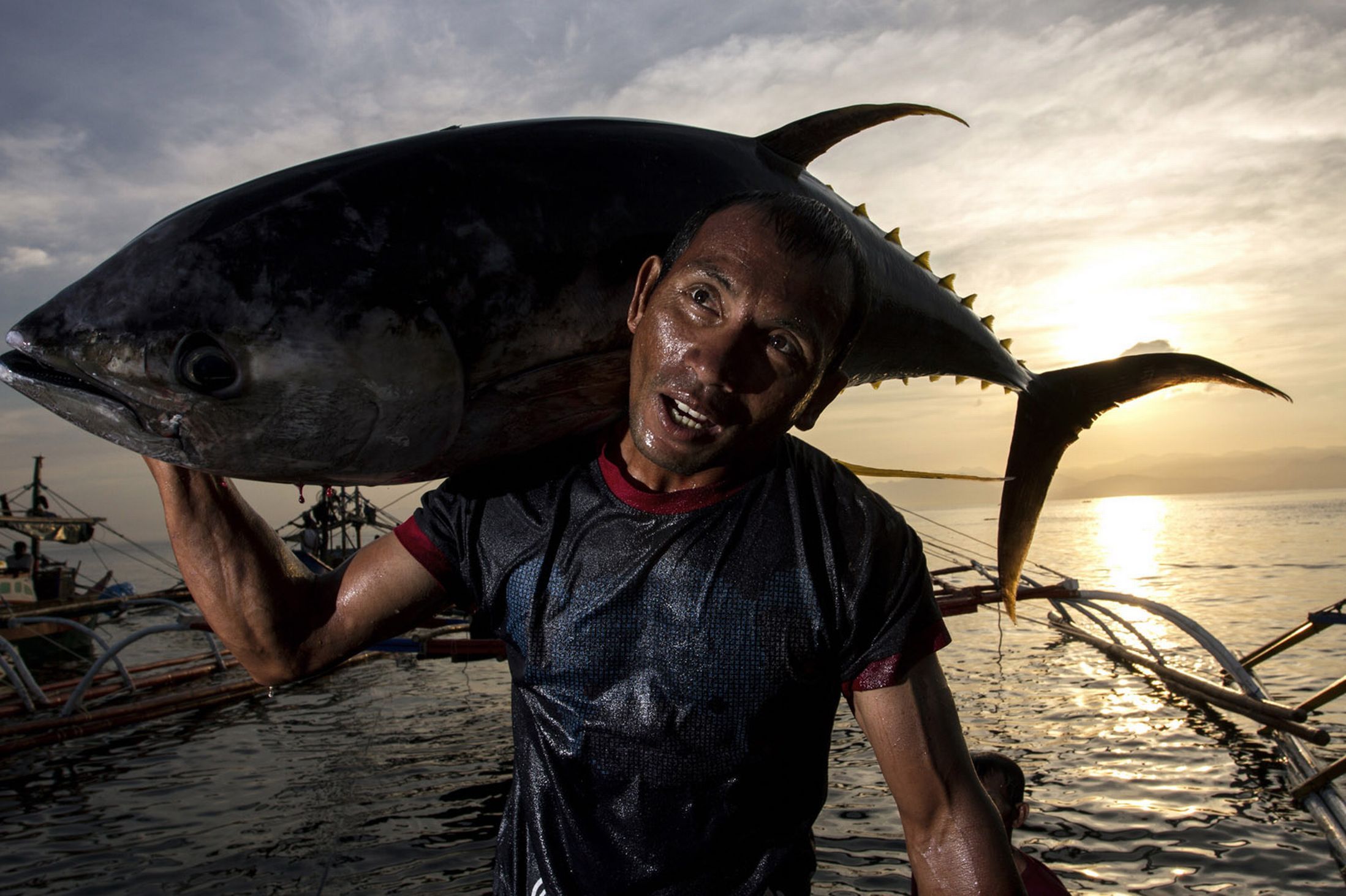 2197x1463 Fisherman's Pride: Stunning HD Wallpaper of a Vibrant Catch