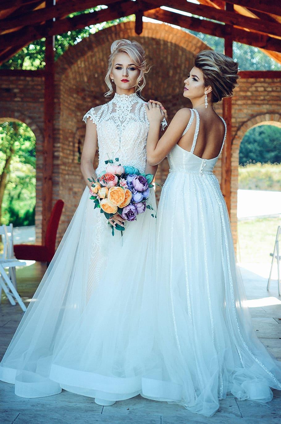 910x1374 HD wallpaper: Woman in White Lace Wedding Dress Holding Flower