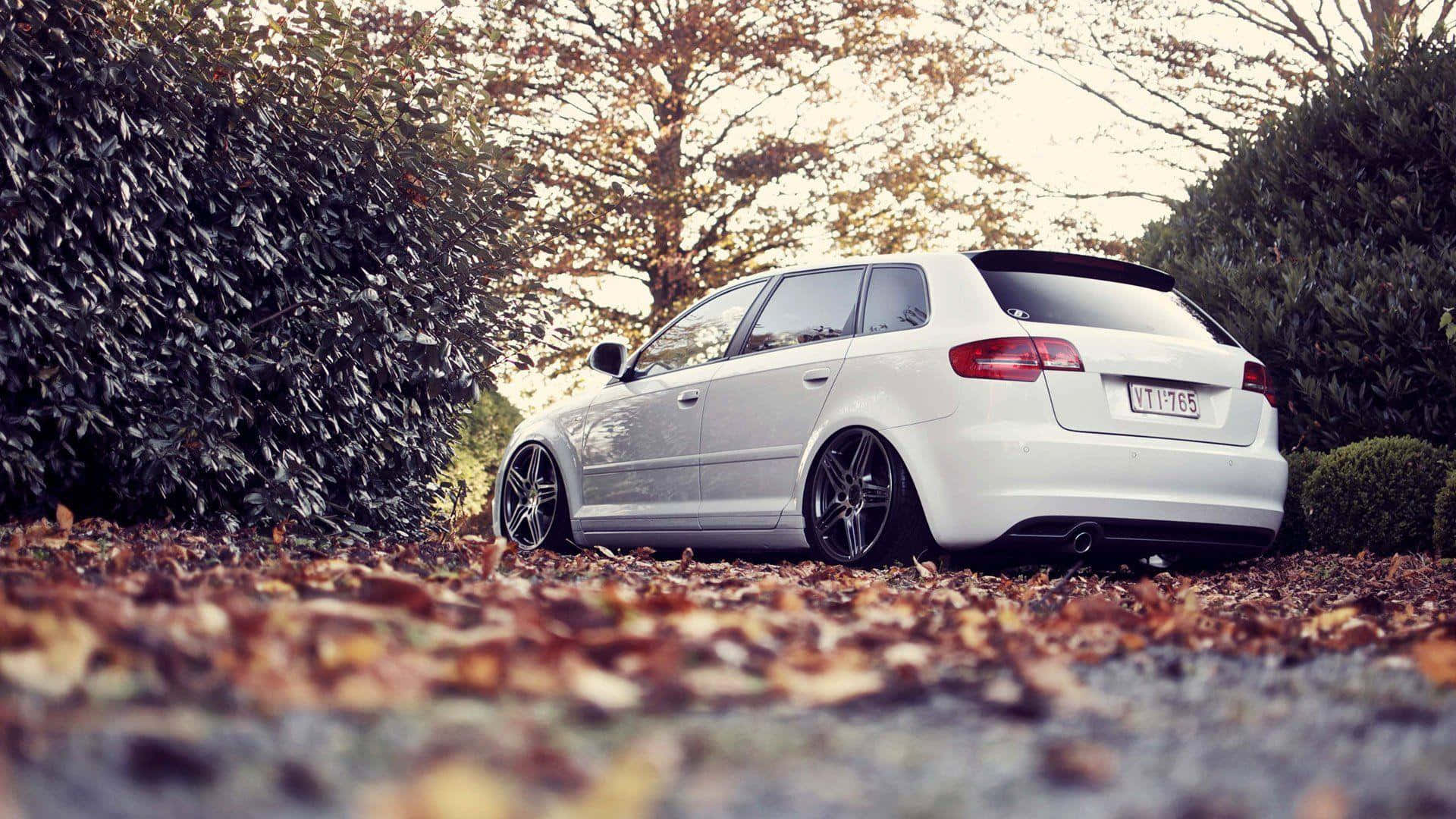 1920x1080 Download Sleek Audi A3 on Scenic Hilly Road Wallpaper