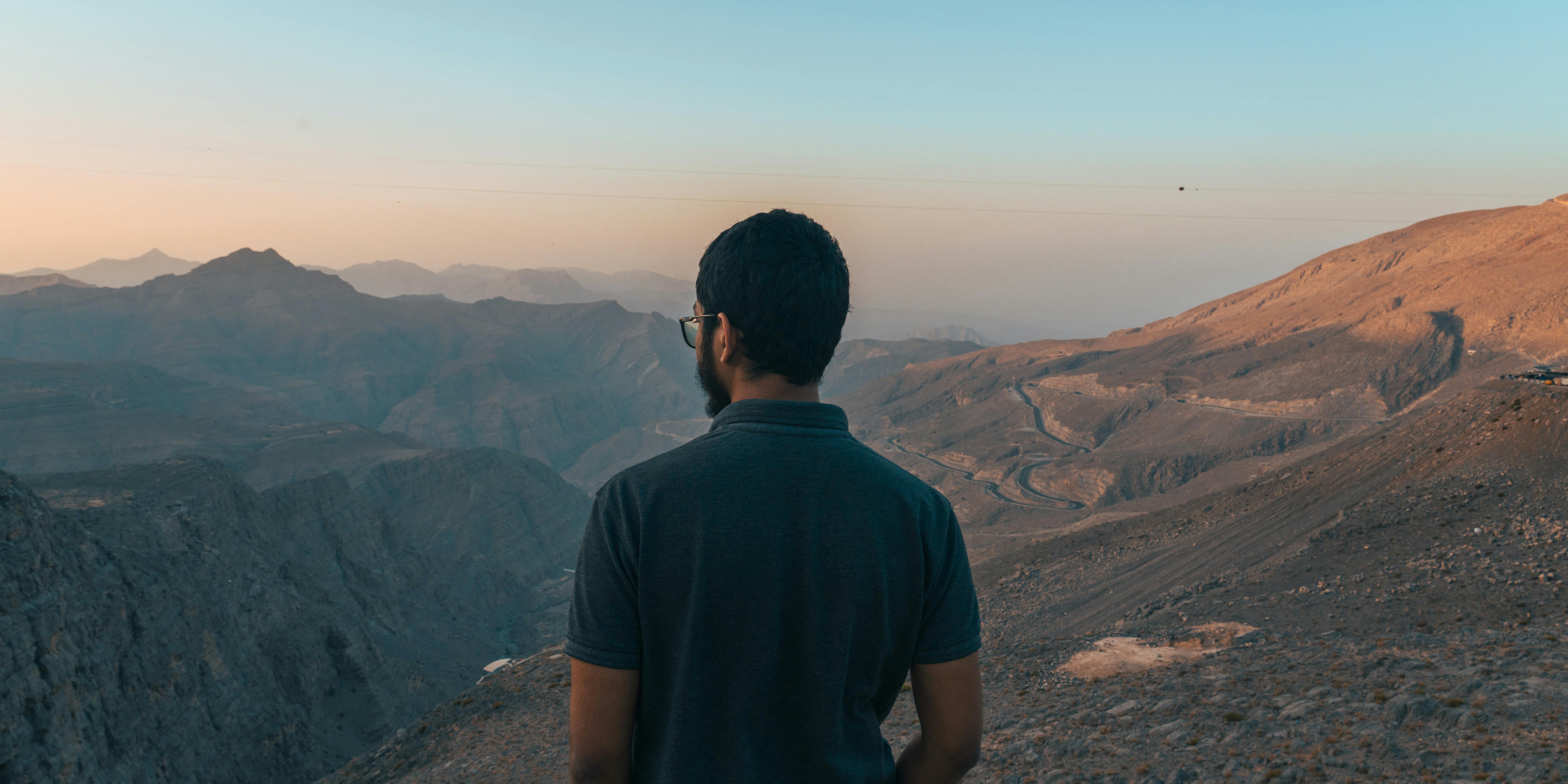 7008x3504 Back View of Man in Mountains · Free