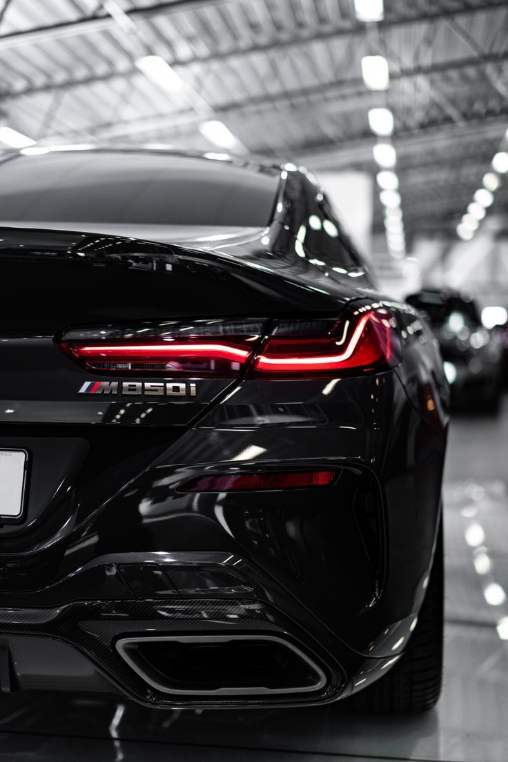 736x1104 Download wallpaper 4000x6000 bmw, car, headlight, rear view HD background