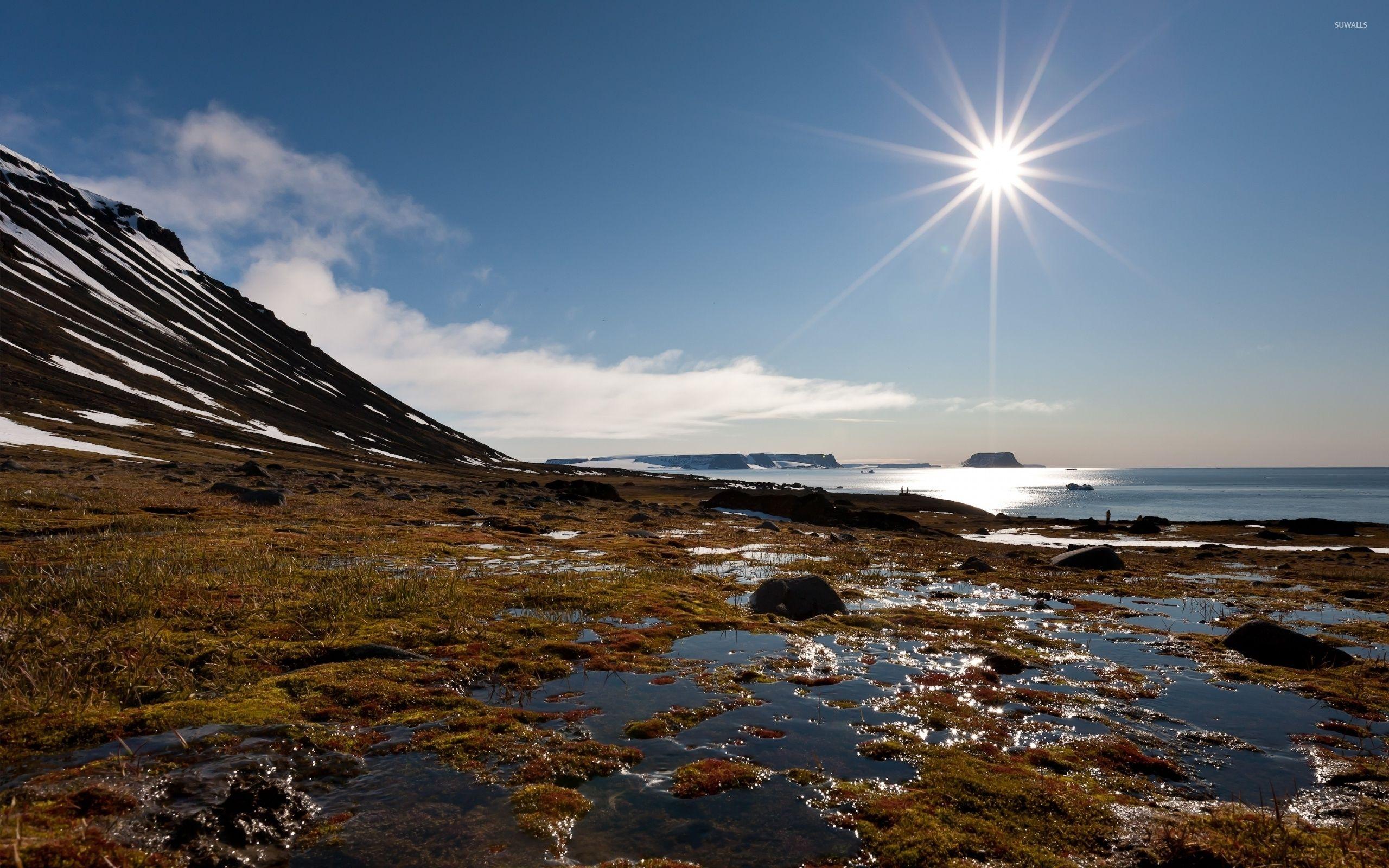 2560x1600 Bright sun high on the blue sky above the ocean wallpaper wallpaper