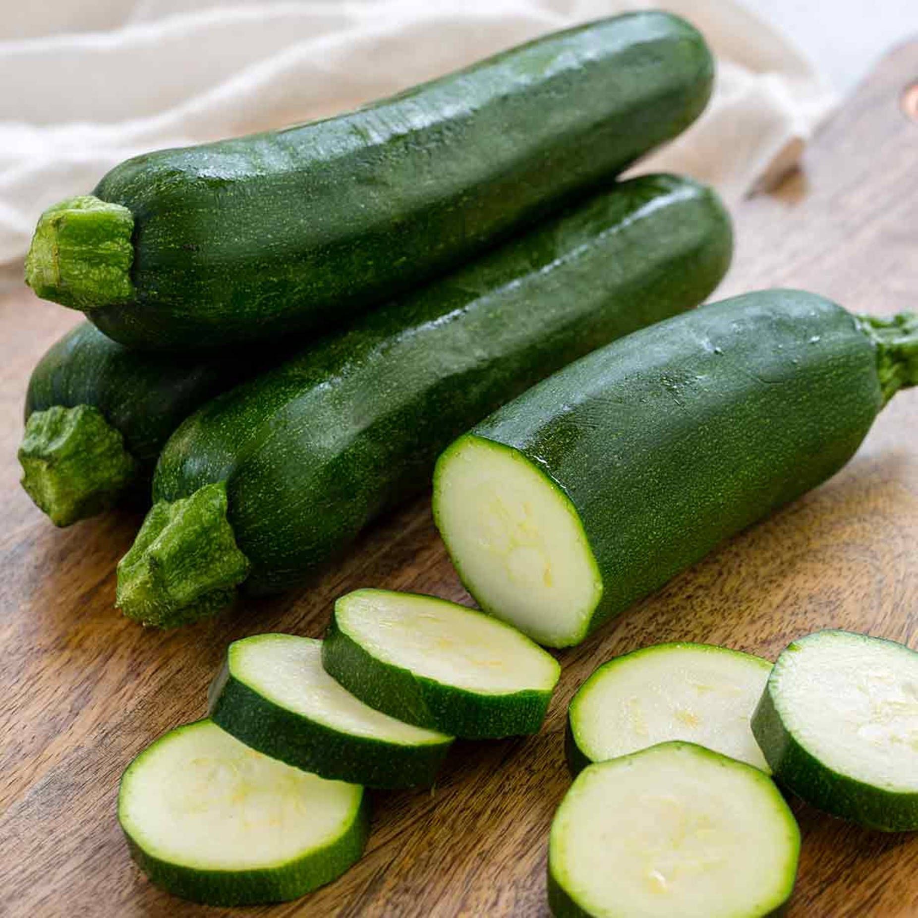 1852x1852 Download Caption: Fresh Zucchini Slices Showcasing White Flesh Wallpaper