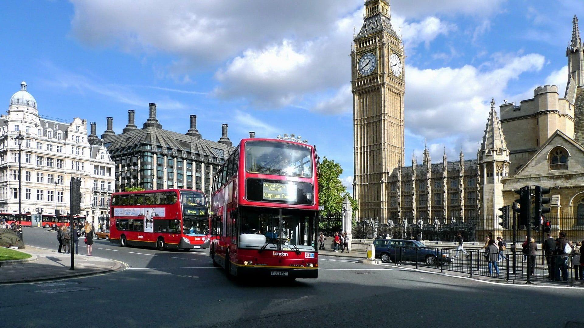 1920x1080 Red double decker bus near Big Ben under cloudy sky during daytime