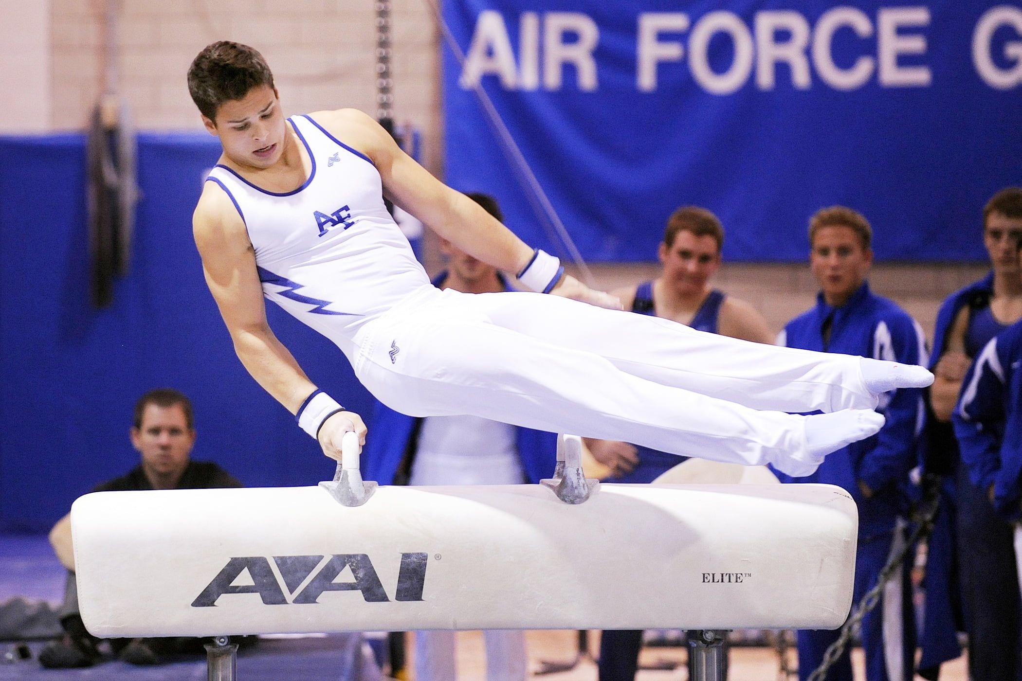 2100x1400 Gymnast on balance beam while the four men watching at the back HD