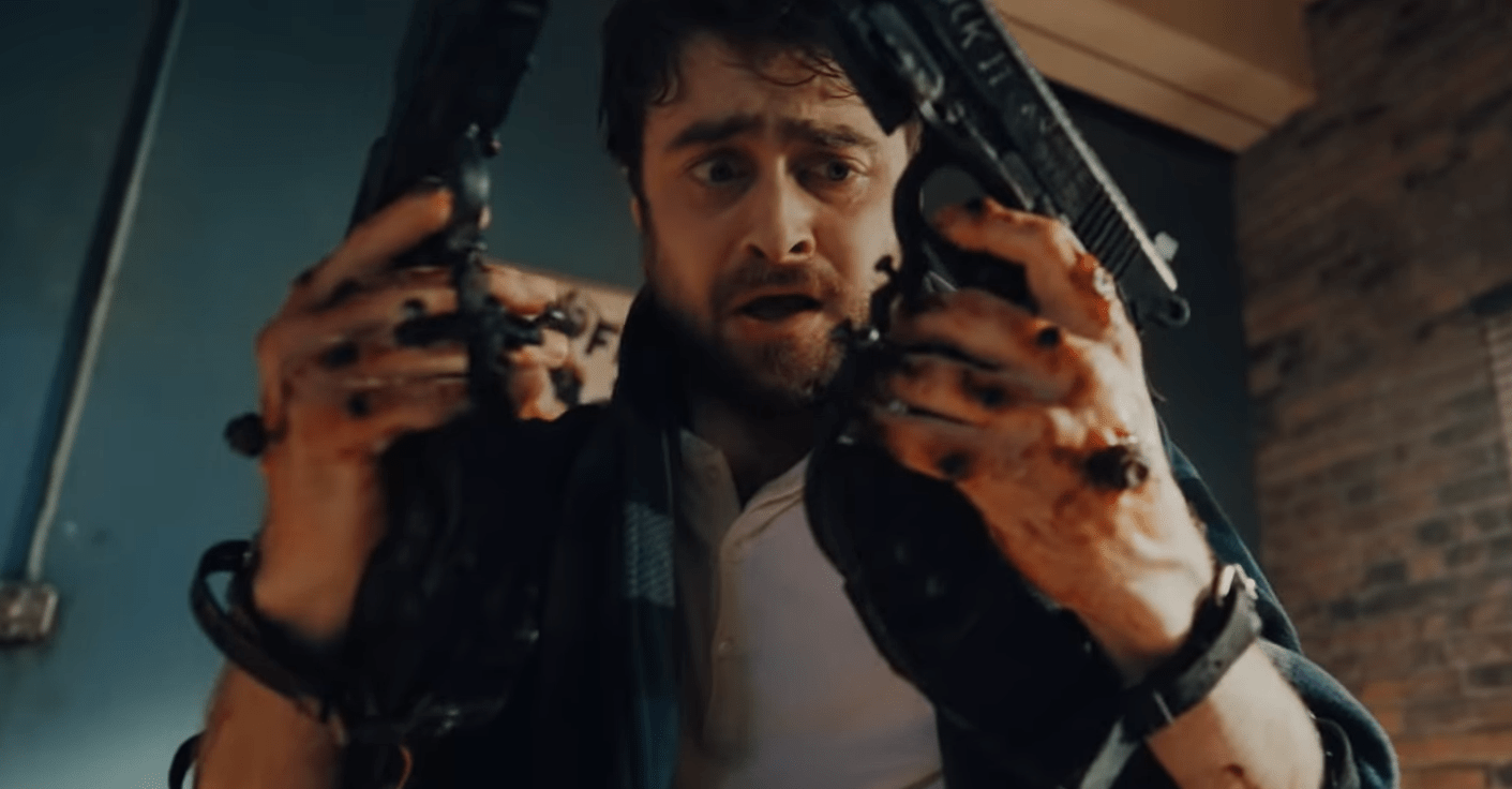 1411x736 See Daniel Radcliffe Fight With Gun Hands in 'Guns Akimbo'