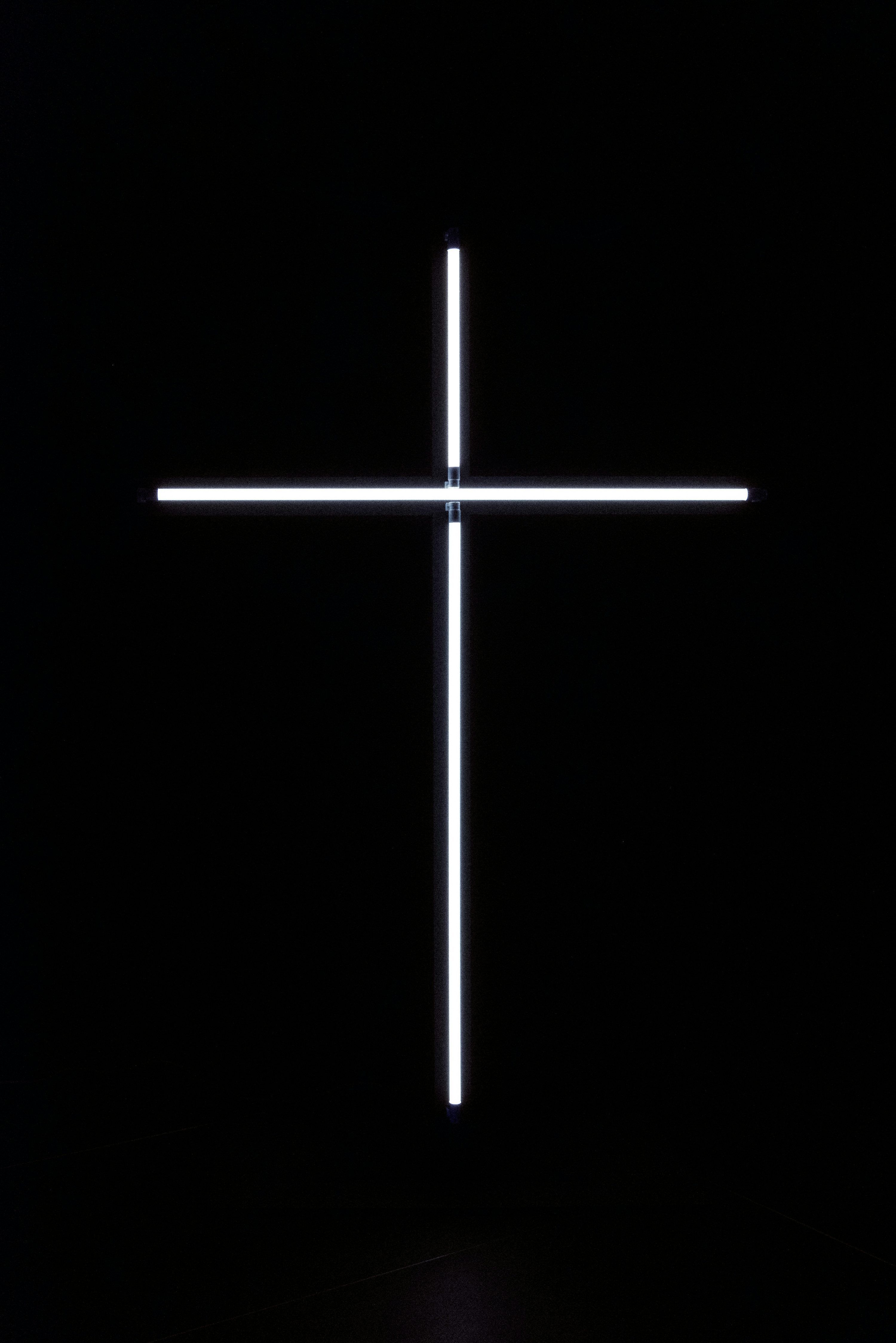 3000x4494 A cross that is lit up in the dark photo