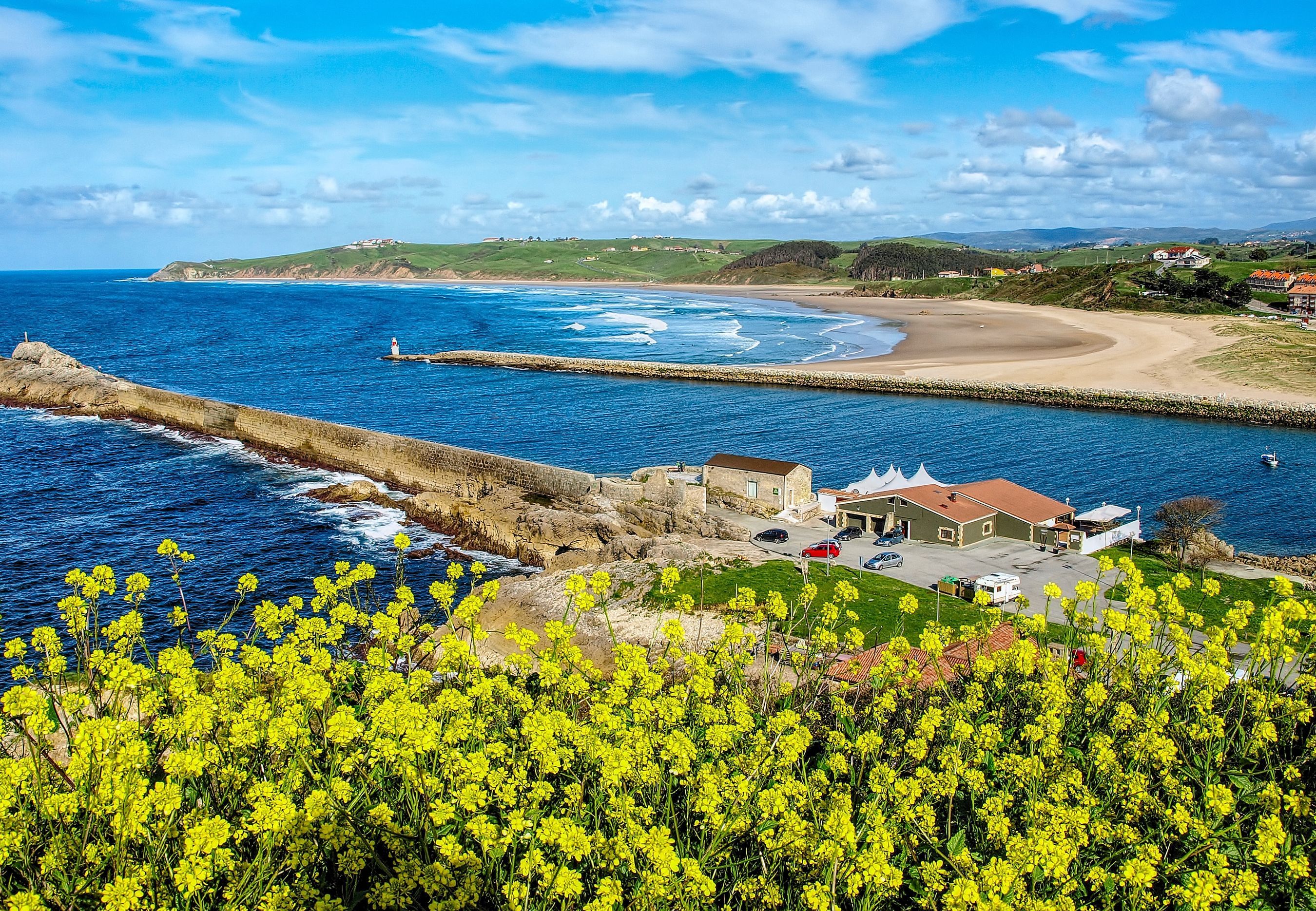 2700x1870 Cantabria Coastline: Sunny Beach and Rapeseed Fields by the Sea in Spain