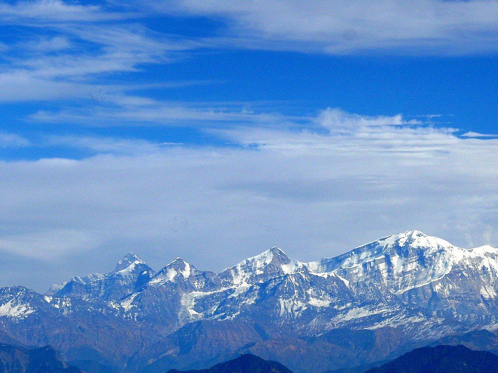 1024x768 From right, Trishul, Nanda Ghunti, Ronti, Bethartoli and Nanda Devi peaks tower in the Garhwal Himalaya