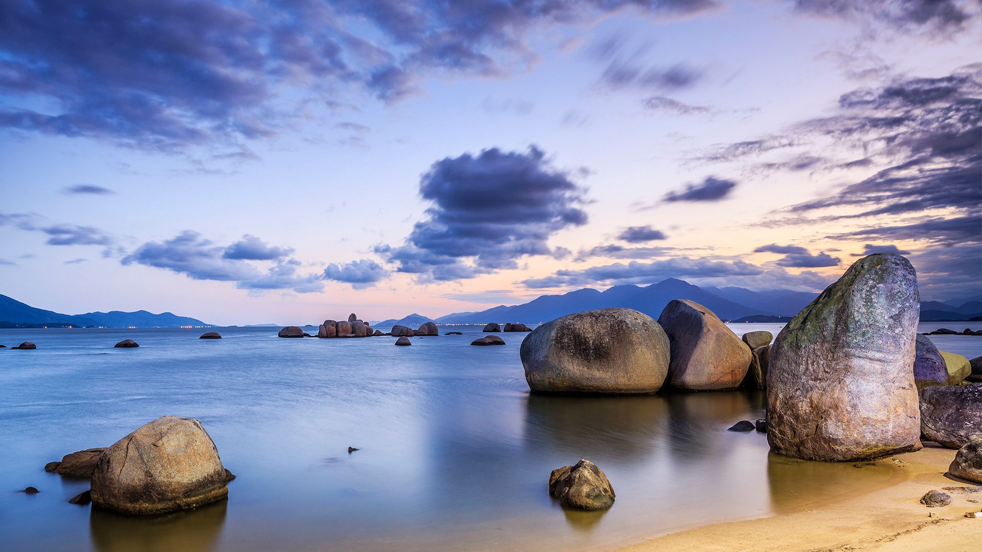 1920x1080 Granite boulders and clouds, Itaguacu, Santa Catarina Island, Florianópolis, Brazil. Windows Spotlight Image