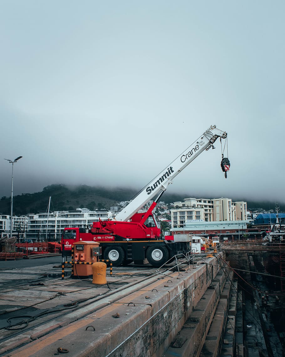 910x1138 HD wallpaper: construction crane, city, urban, waterfront, boat, nature, photo