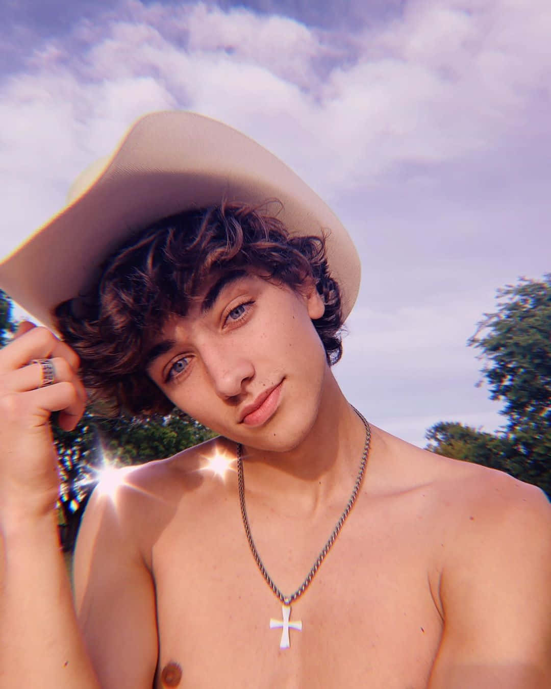 1080x1350 Cowboy Hat Portrait Sunflare Wallpaper