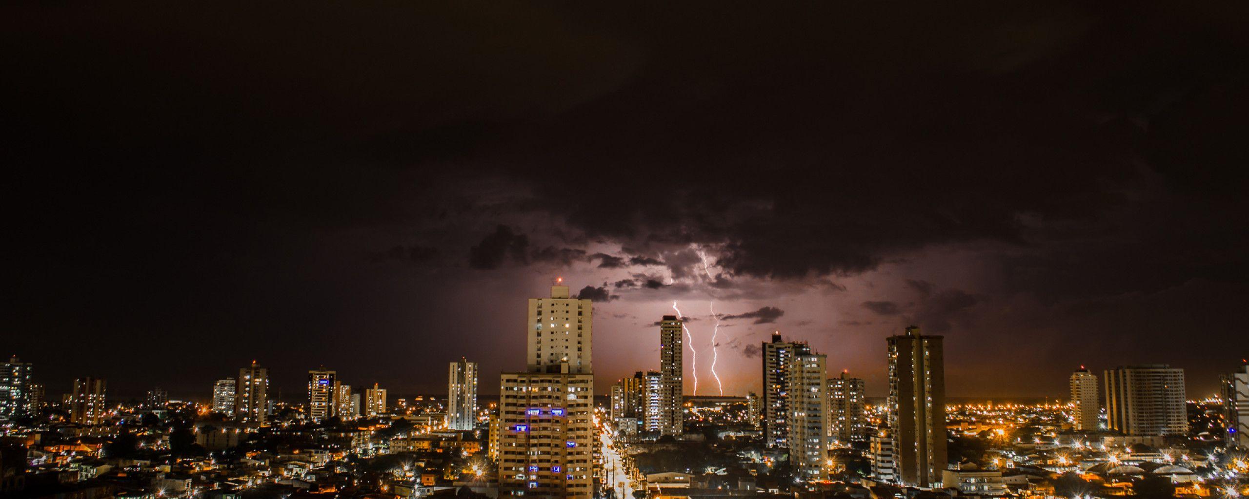 2560x1024 Thunderstorms Above City During Night Time 2560x1024