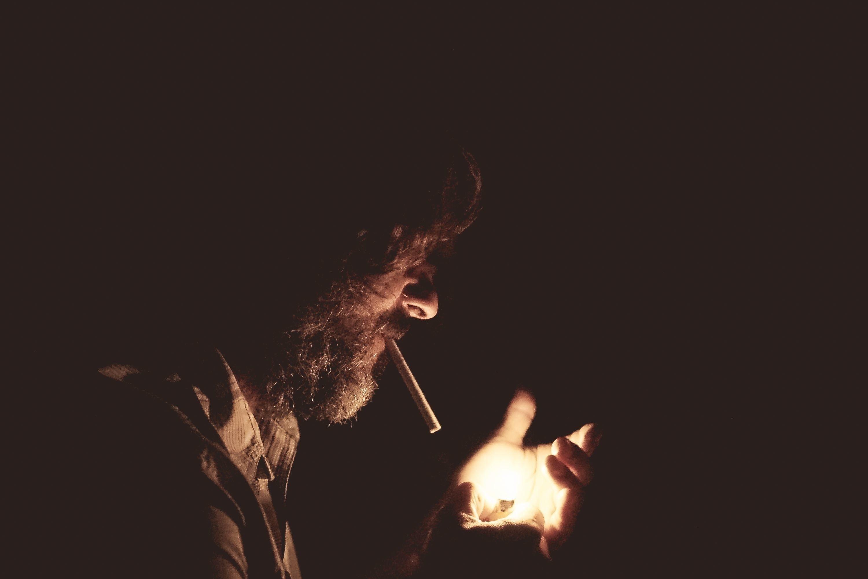 3000x2000 Man with cigarette holding lighter HD wallpaper